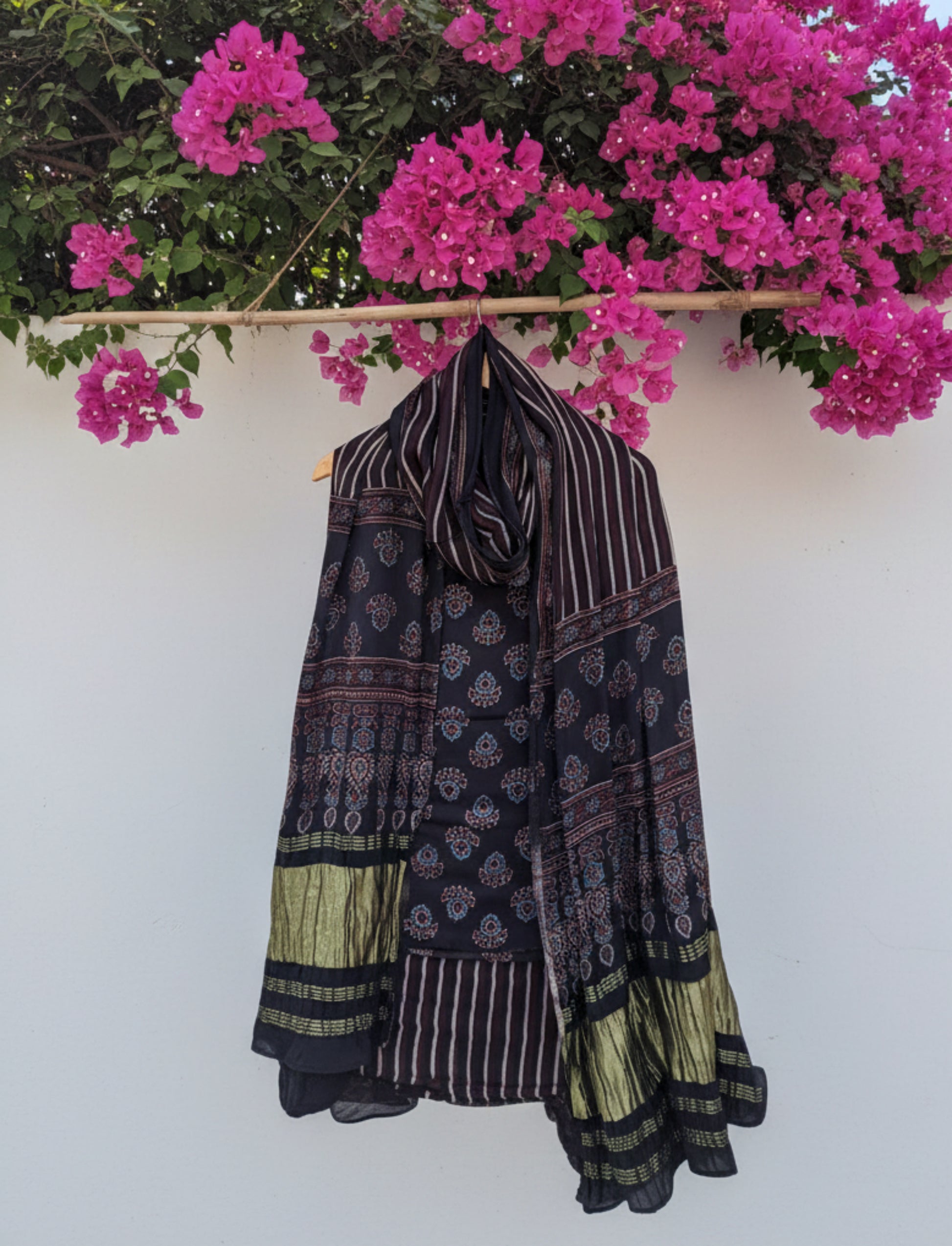 Ajrakh hand block printed black modal silk unstitched suit set with traditional motifs and matching dupatta