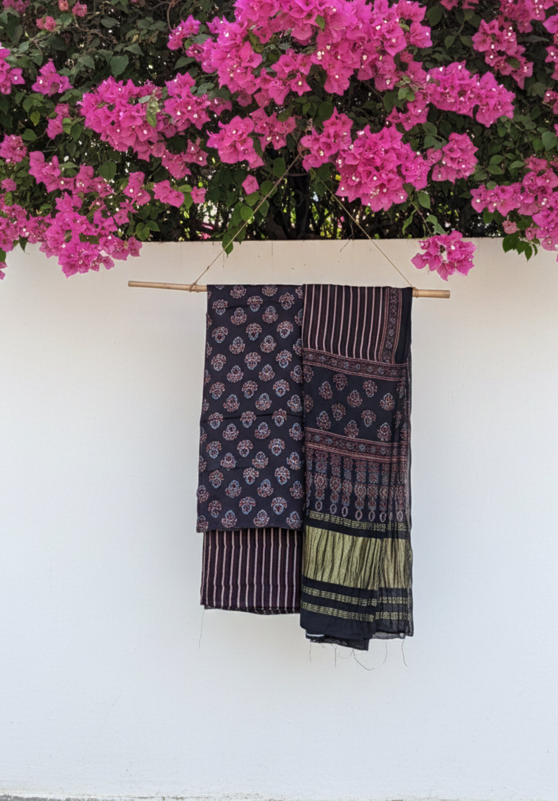 Ajrakh hand block printed black modal silk unstitched suit set with traditional motifs and matching dupatta