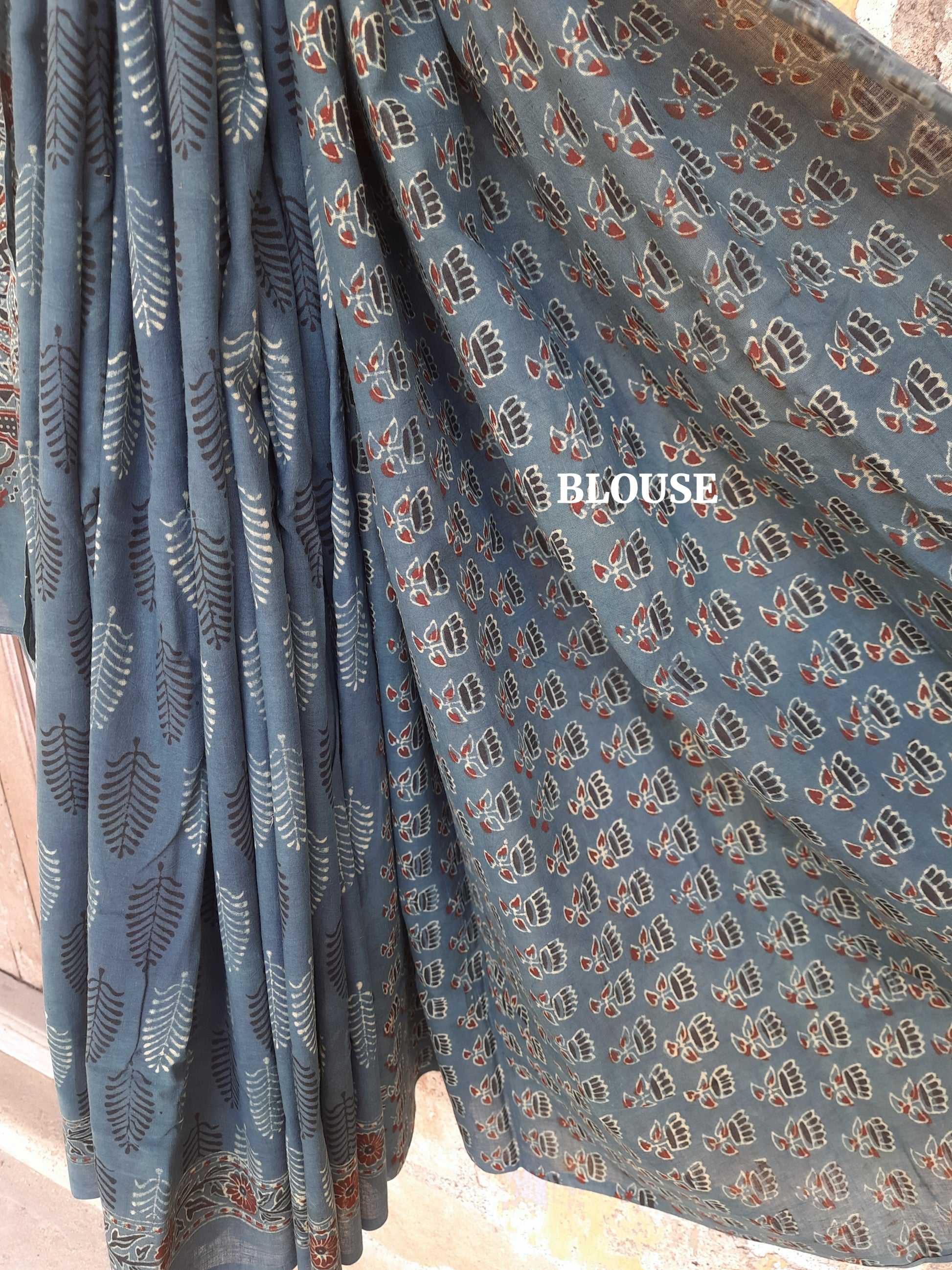 Naturally dyed green cotton Ajrakh hand block print saree with all-over traditional motifs, detailed Ajrakh borders, and a richly patterned pallu, handcrafted in India using age-old techniques.