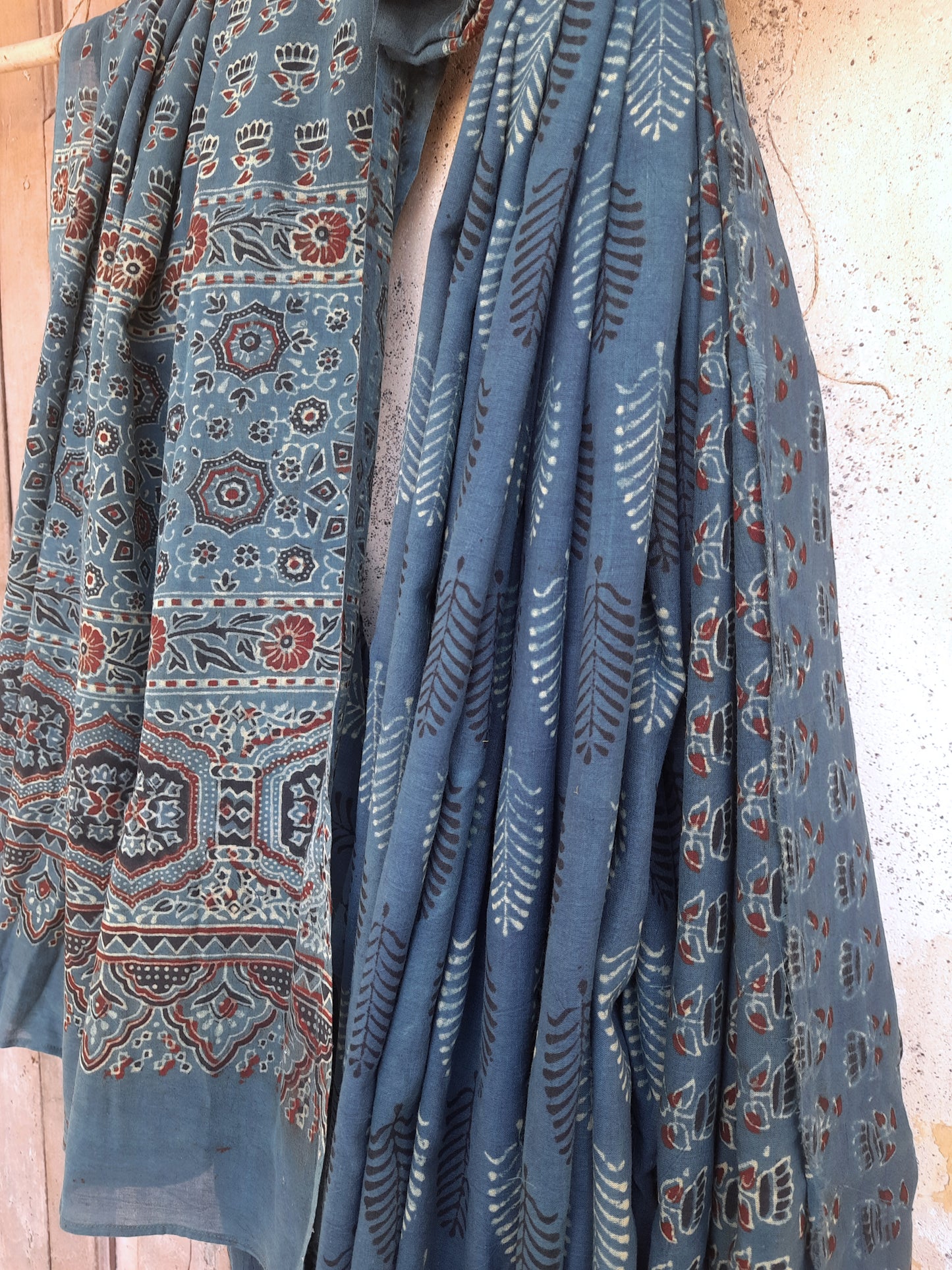 Naturally dyed green cotton Ajrakh hand block print saree with all-over traditional motifs, detailed Ajrakh borders, and a richly patterned pallu, handcrafted in India using age-old techniques.