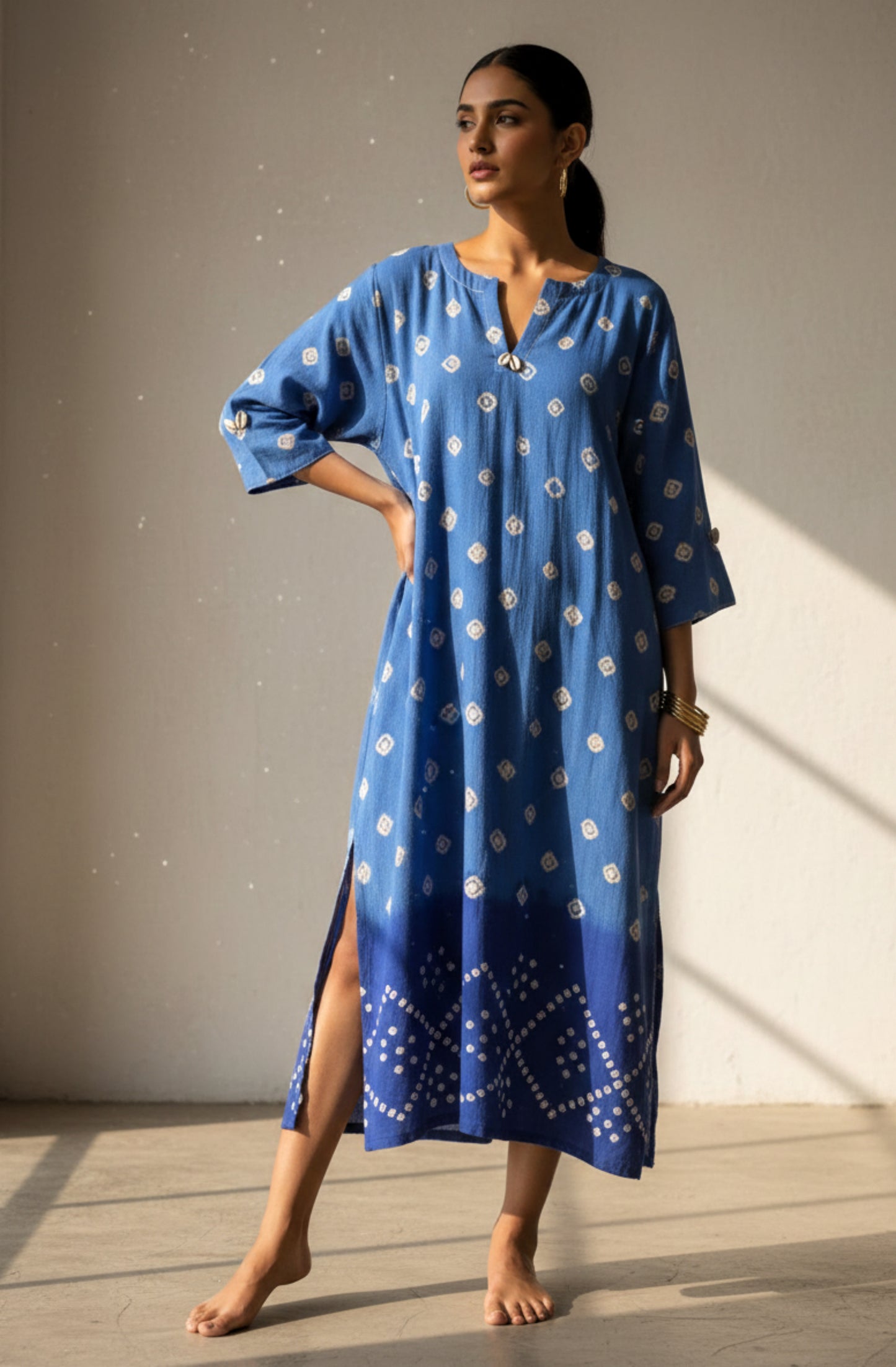 Oversized Bandhani kurta crafted in hand spun and handwoven organic cotton, featuring hand tie dyed patterns, subtle cowrie shell accents and short side slits. Breathable, slow made and handcrafted kurta designed for relaxed everyday wear in India.