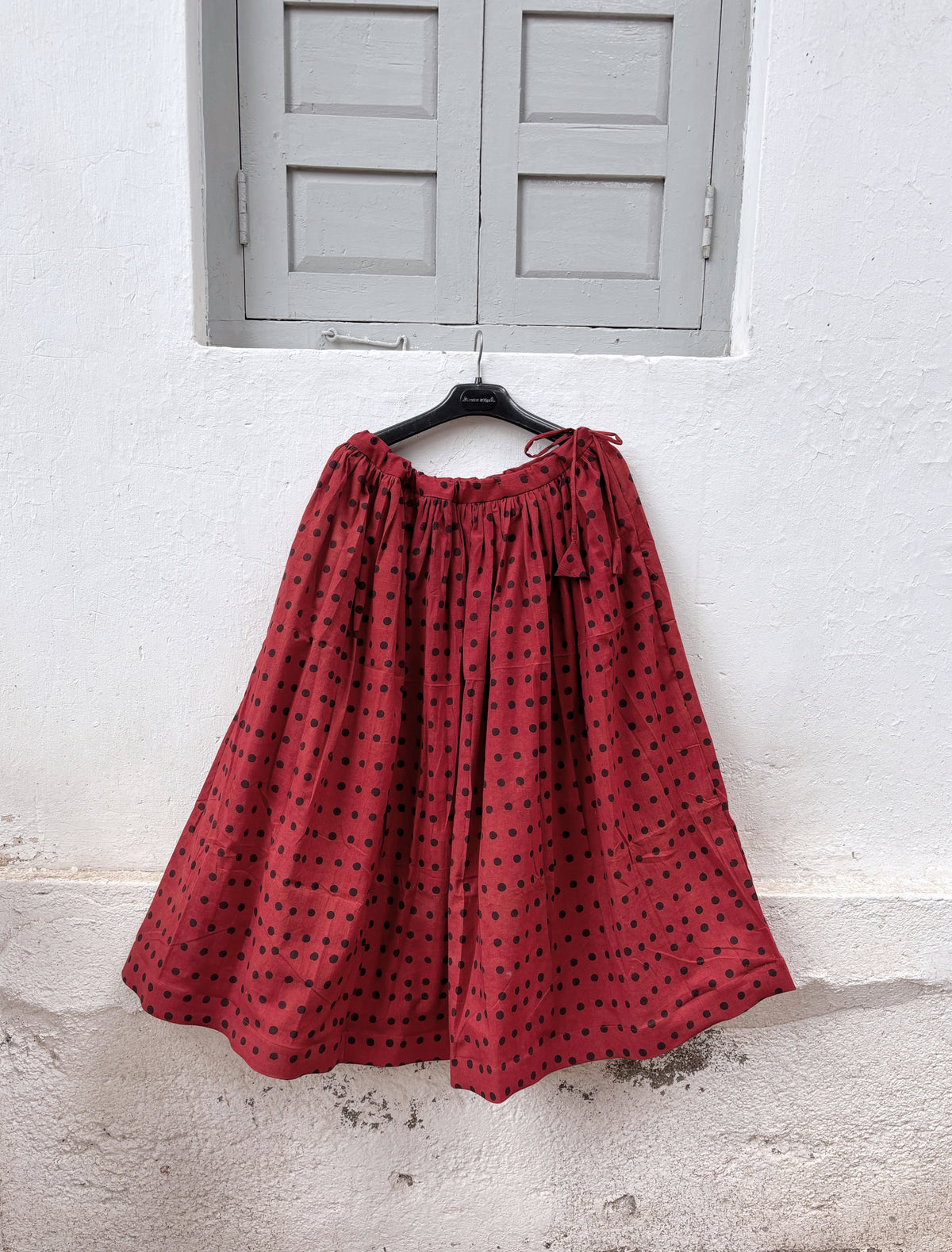 Aaruni madder dyed Ajrakh polka dot cotton coord set with cropped sleeveless shirt and flared skirt
