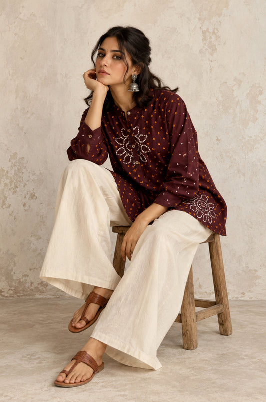 Agnik deep brown cotton shirt with turmeric-yellow and off-white hand tie-dyed Bandhani motifs, soft mandarin collar and partial button placket