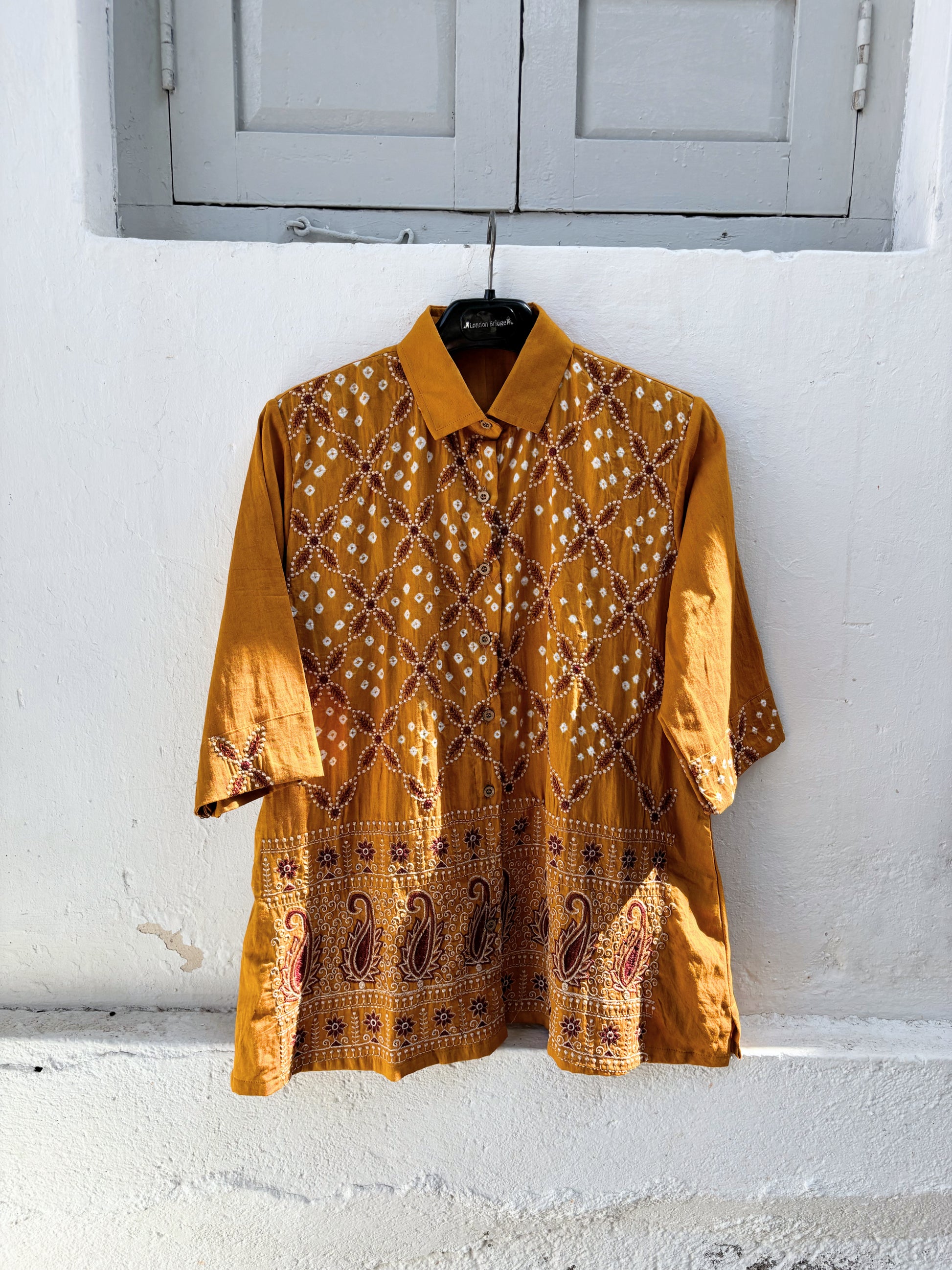 Ambadi Dani mustard Bandhani embroidered cotton satin relaxed fit collared shirt for women