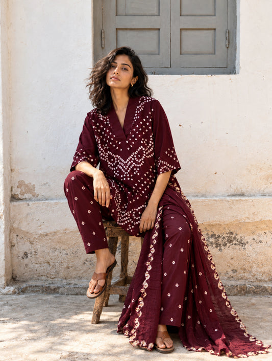 Anar deep wine Bandhani three-piece set with V-neck top, matching pants and cotton dupatta