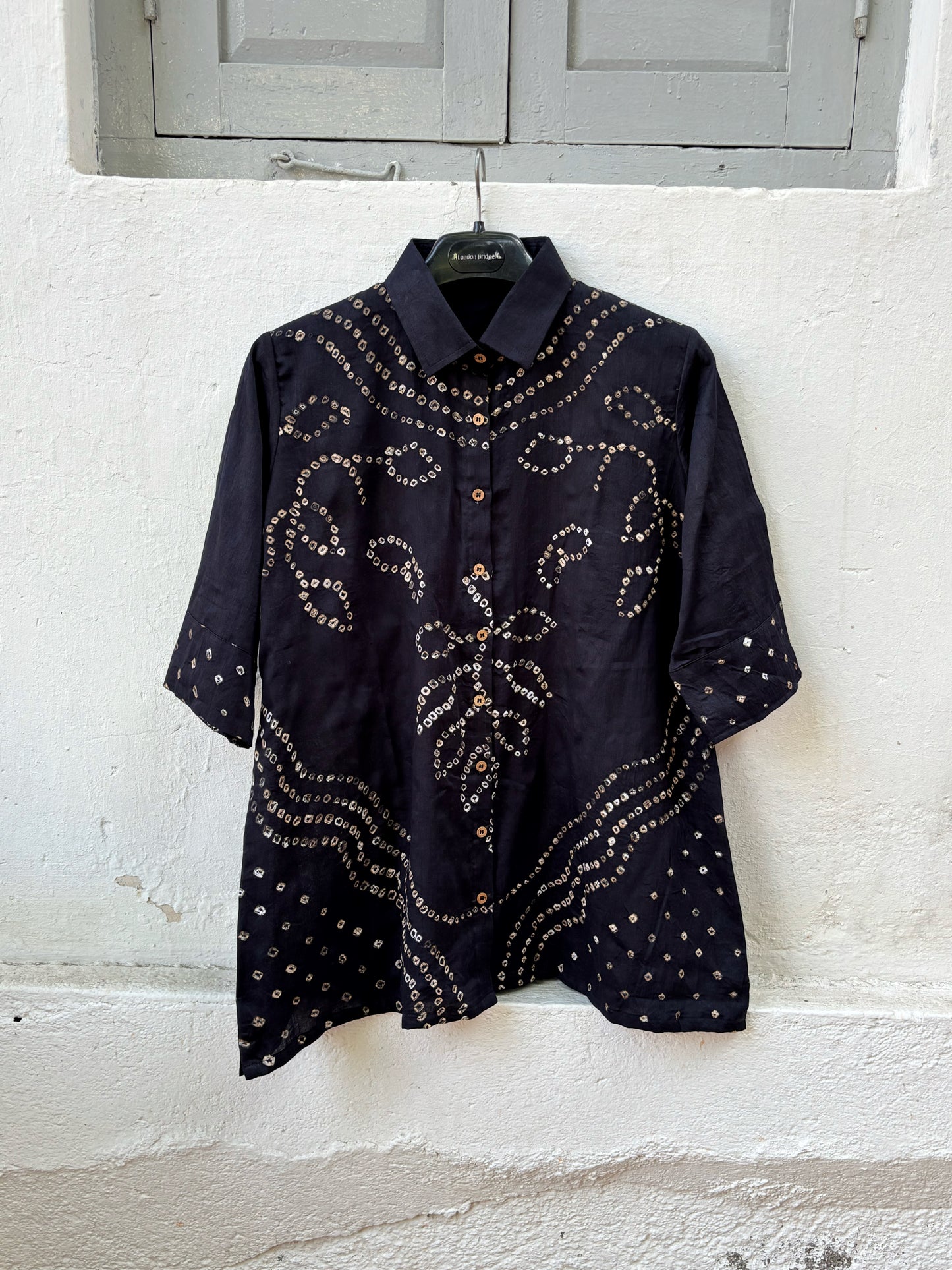 Black Bandhani shirt for women with hand tie dyed ivory patterns in cotton satin, relaxed fit and classic collar design