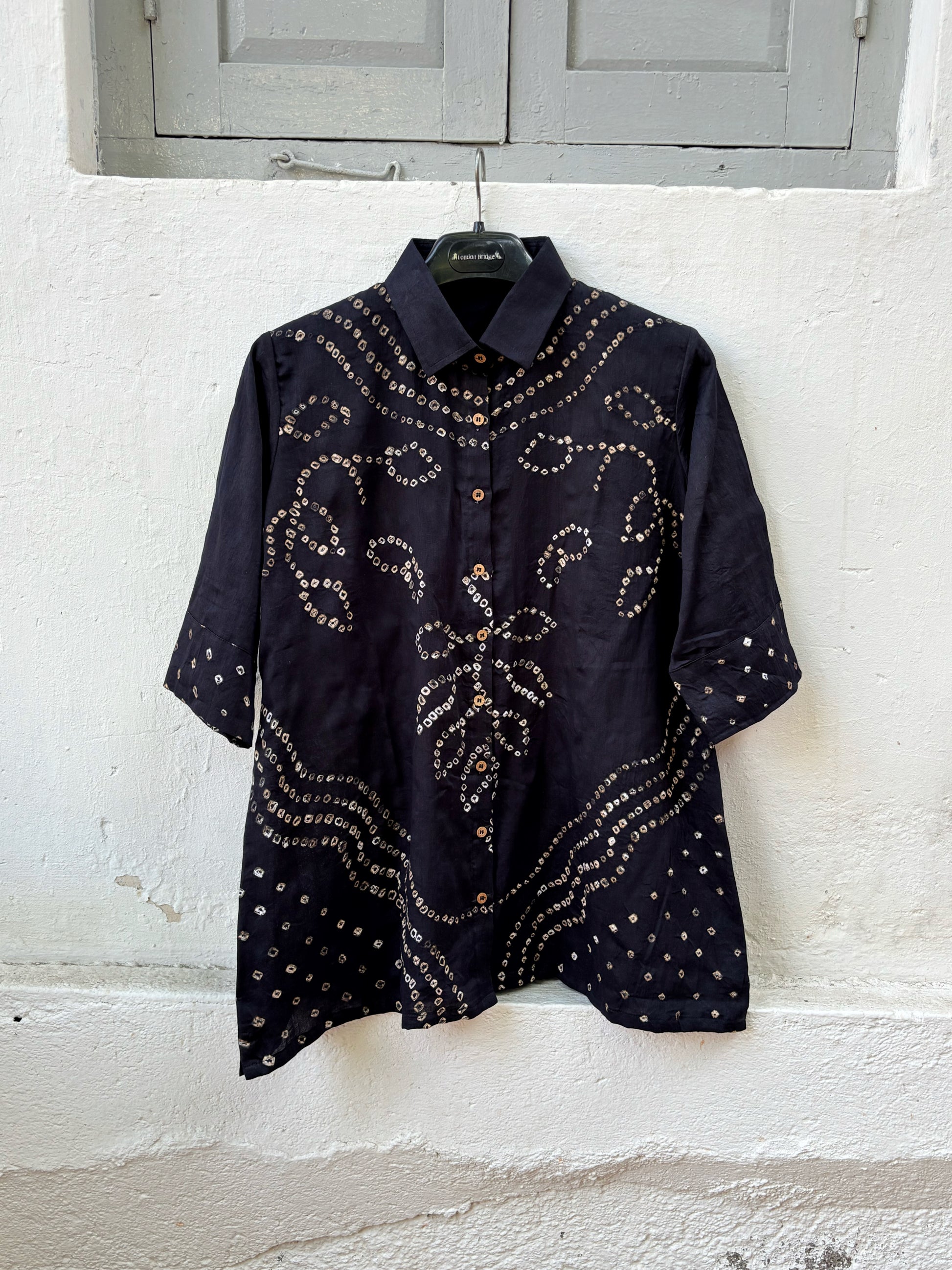 Black Bandhani shirt for women with hand tie dyed ivory patterns in cotton satin, relaxed fit and classic collar design
