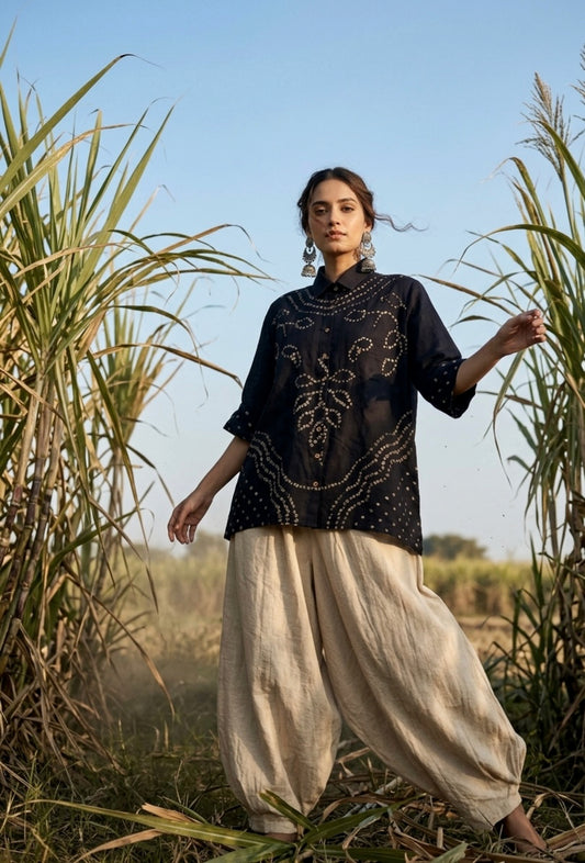 Black Bandhani shirt for women with hand tie dyed ivory patterns in cotton satin, relaxed fit and classic collar design