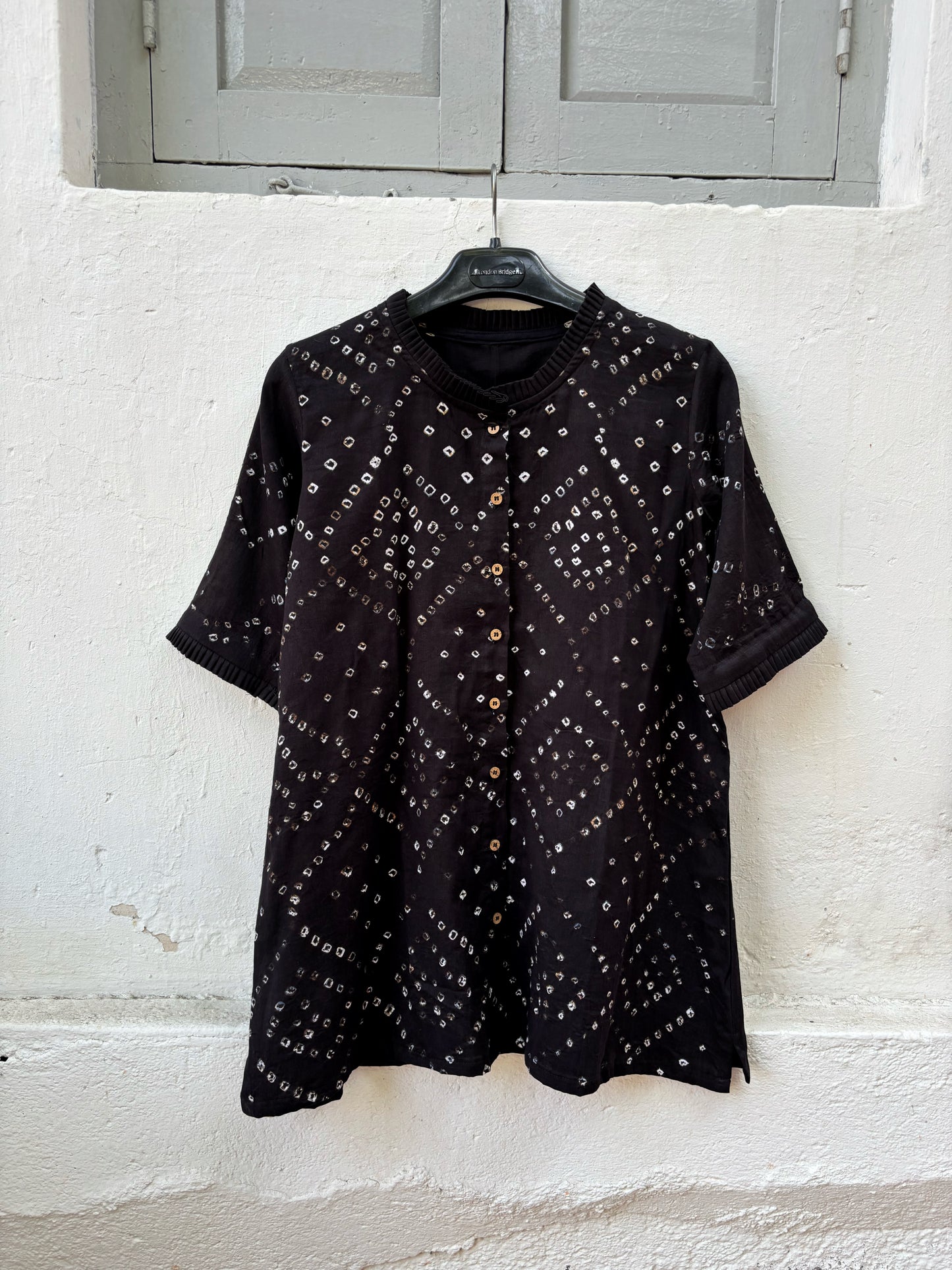 Black Bandhani shirt for women with pleated neckline and sleeve hems, hand tie dyed geometric patterns on cotton satin, relaxed fit