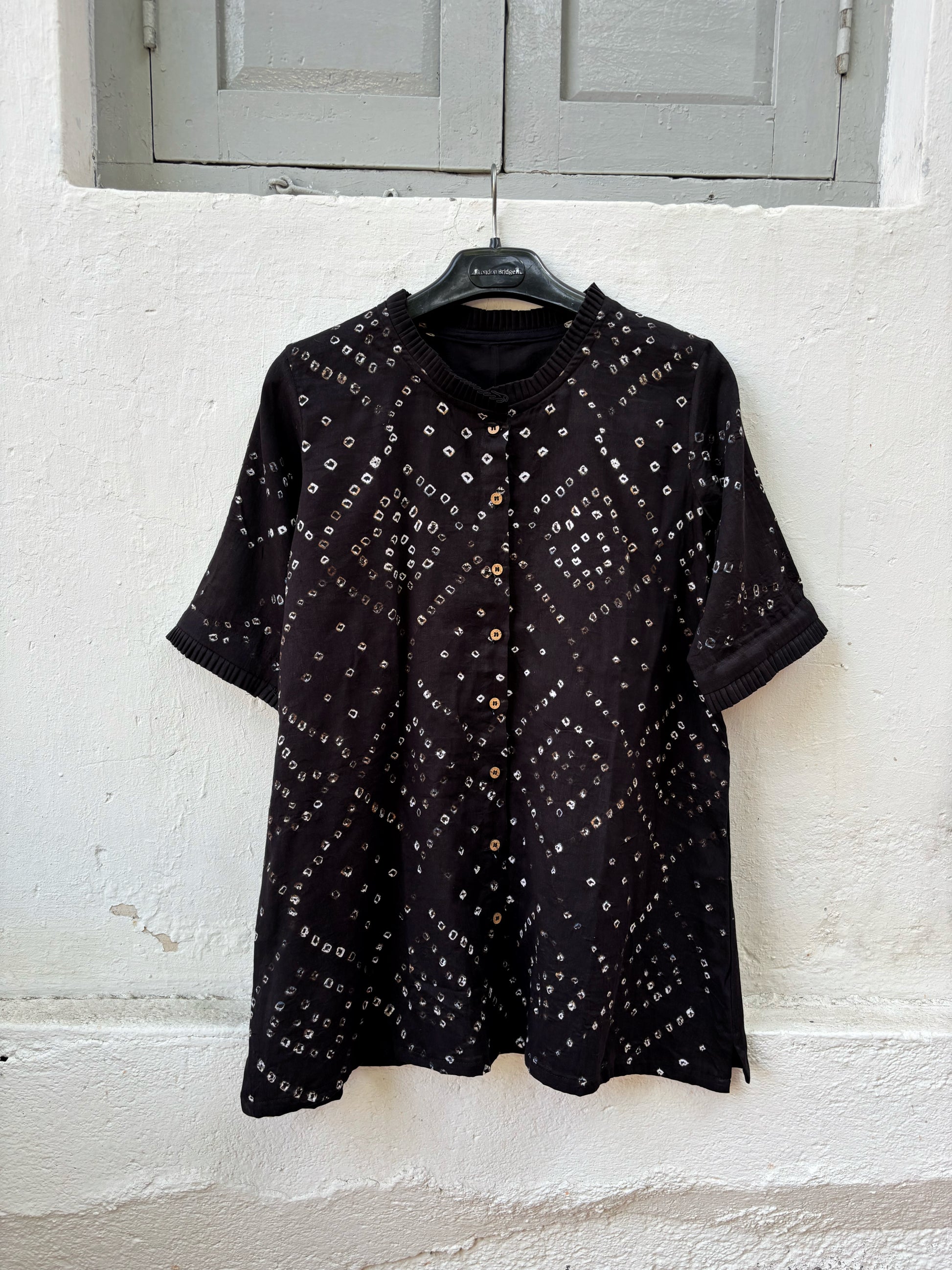 Black Bandhani shirt for women with pleated neckline and sleeve hems, hand tie dyed geometric patterns on cotton satin, relaxed fit