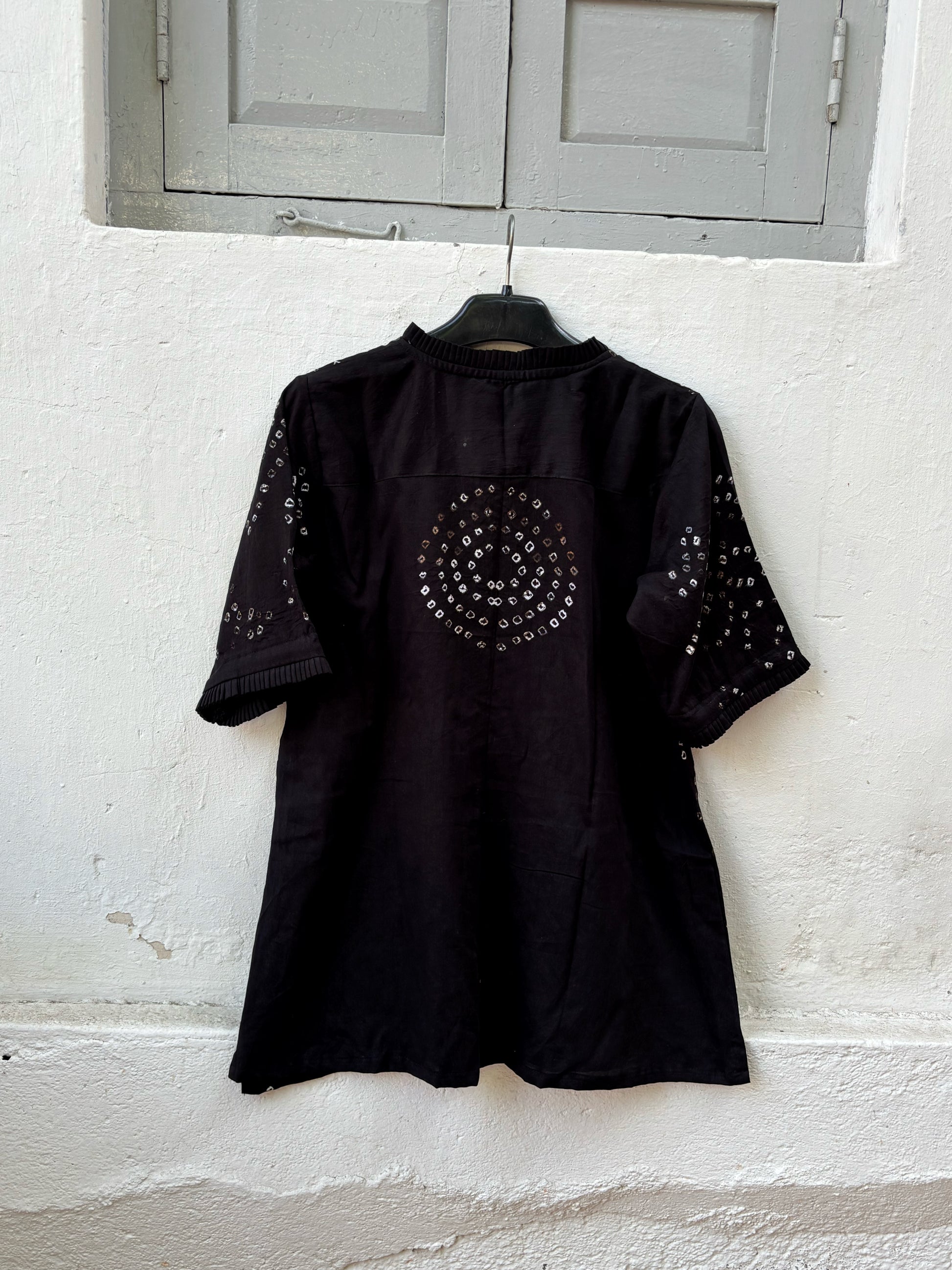 Black Bandhani shirt for women with pleated neckline and sleeve hems, hand tie dyed geometric patterns on cotton satin, relaxed fit