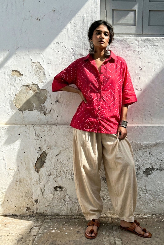Hand tie-dyed Bougainvillea Pink Bandhani cotton satin shirt with geometric white Bandhani motifs and a classic shirt collar.