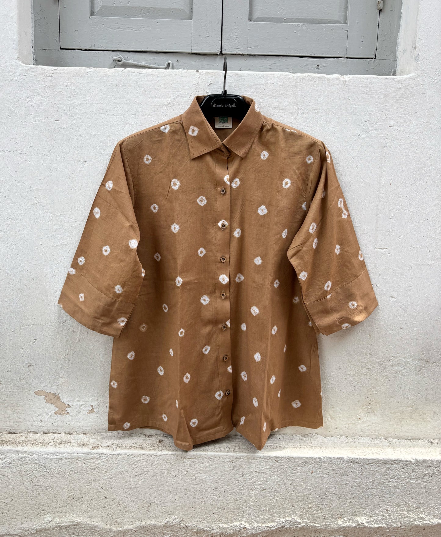 Women's camel brown cotton Bandhani shirt with wooden buttons.