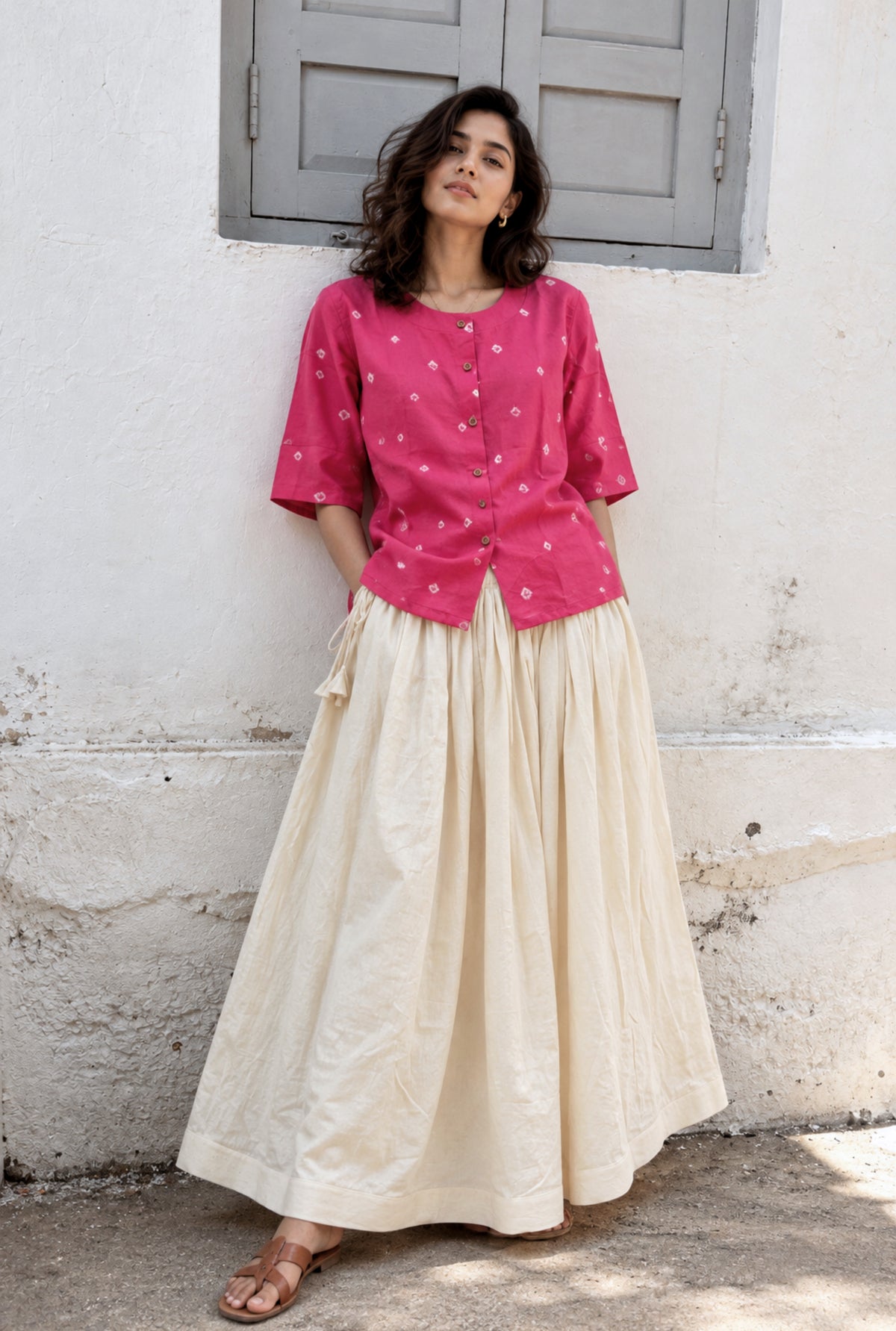 Chhabili gulabi pink Bandhani cotton satin shirt styled with an off-white full-length skirt