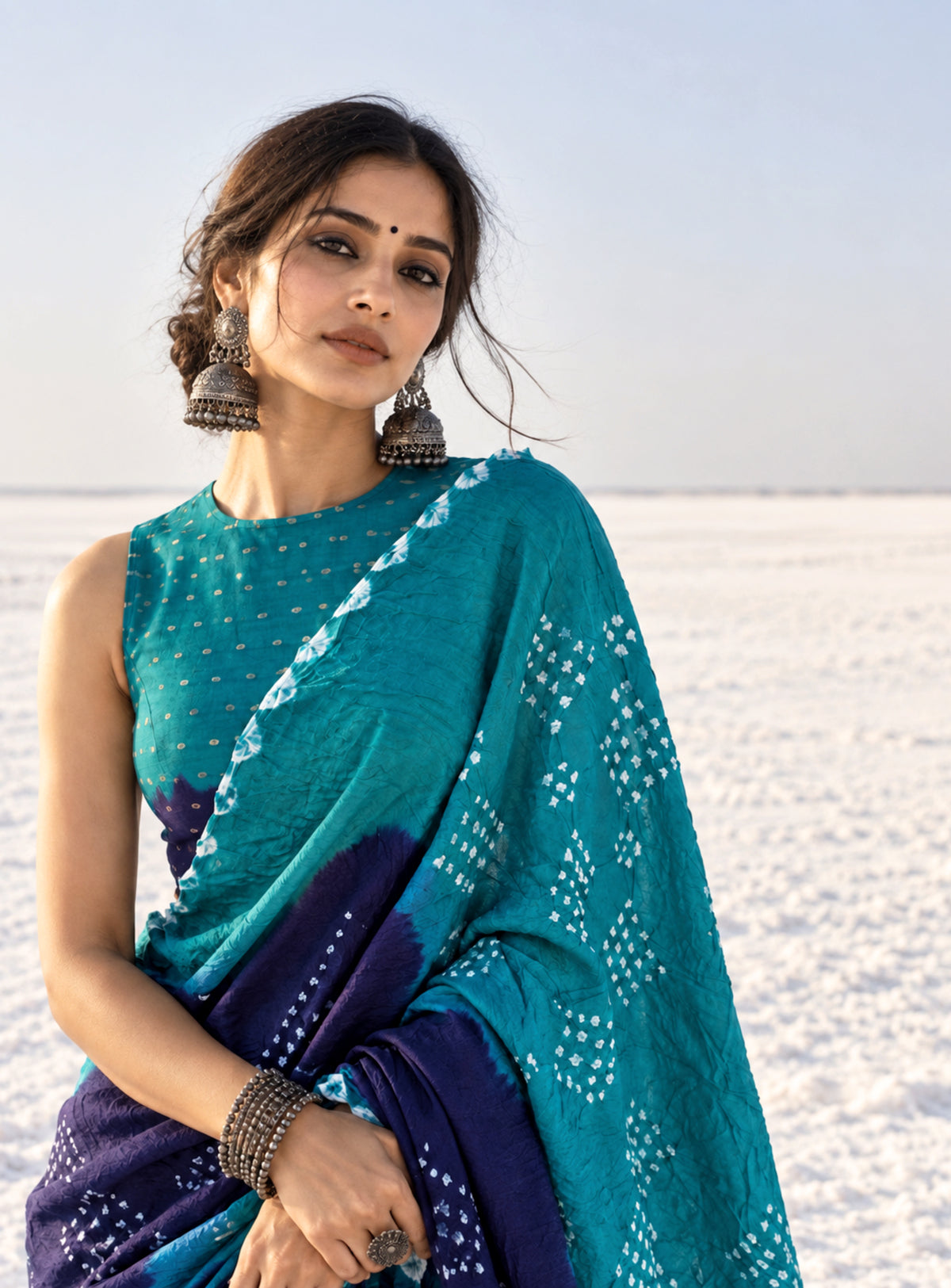 Deep teal green and deep indigo hand tie-dyed Bandhani cotton saree with white floral and geometric dotted motifs