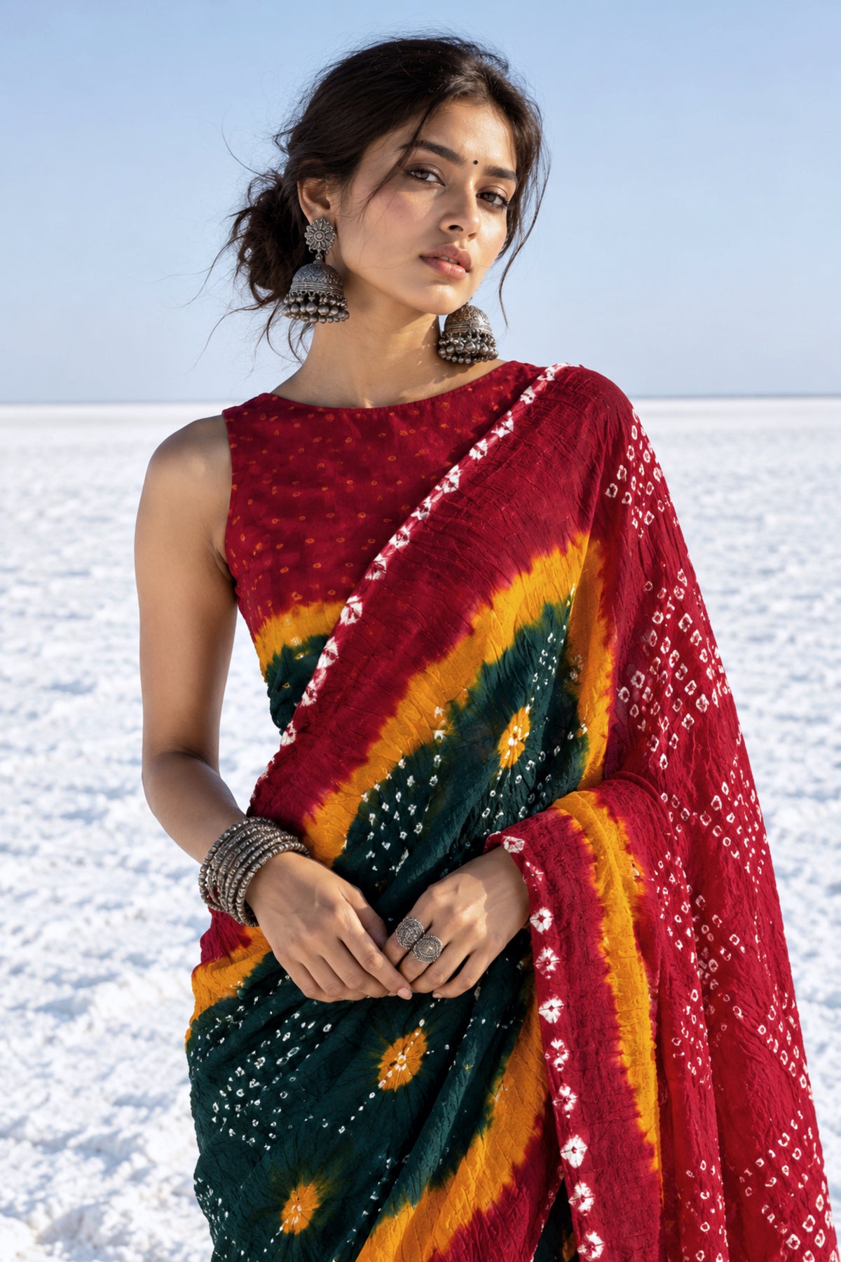 Dhun hand tie-dyed Bandhani cotton saree in deep maroon, forest green and kesari yellow with white geometric and floral motifs