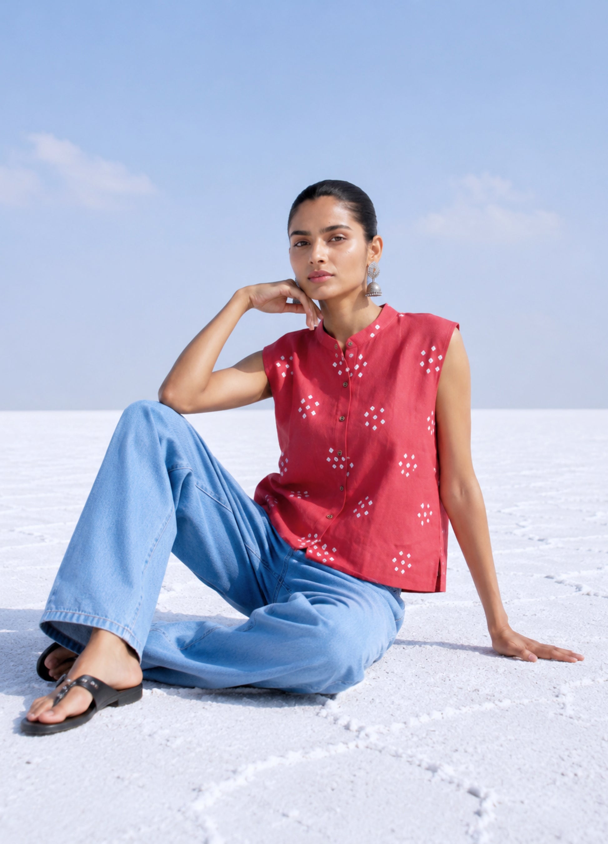 Dusty guava pink hand spun handwoven organic cotton Bandhani sleeveless shirt with white Bandhani butis and mandarin collar