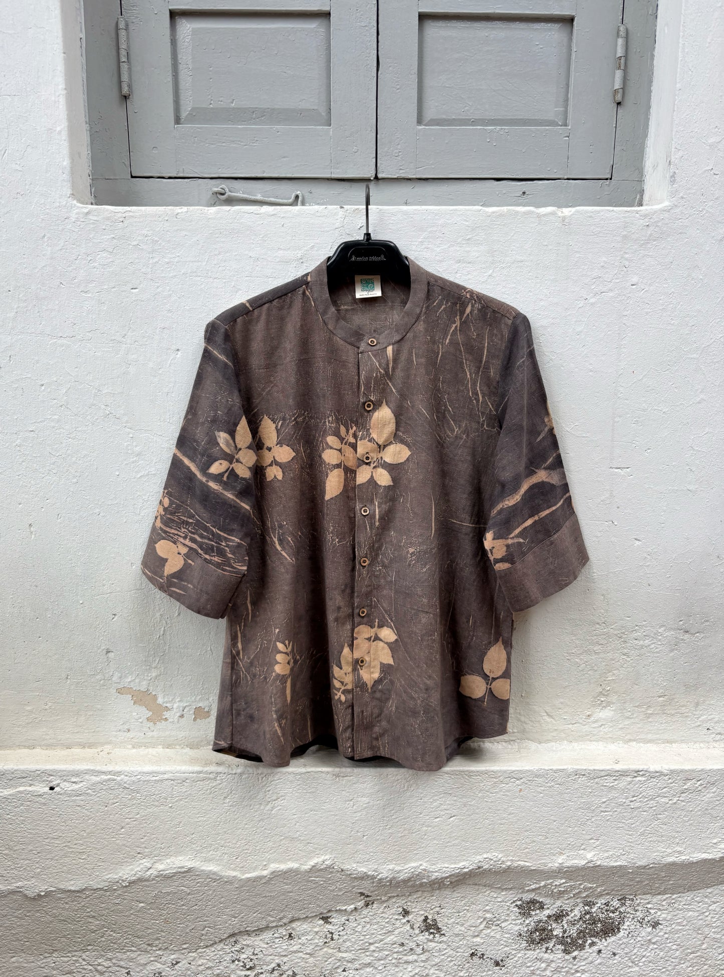 Hand-spun and hand-woven cotton shirt naturally dyed in earthy brown-grey with botanical eco prints