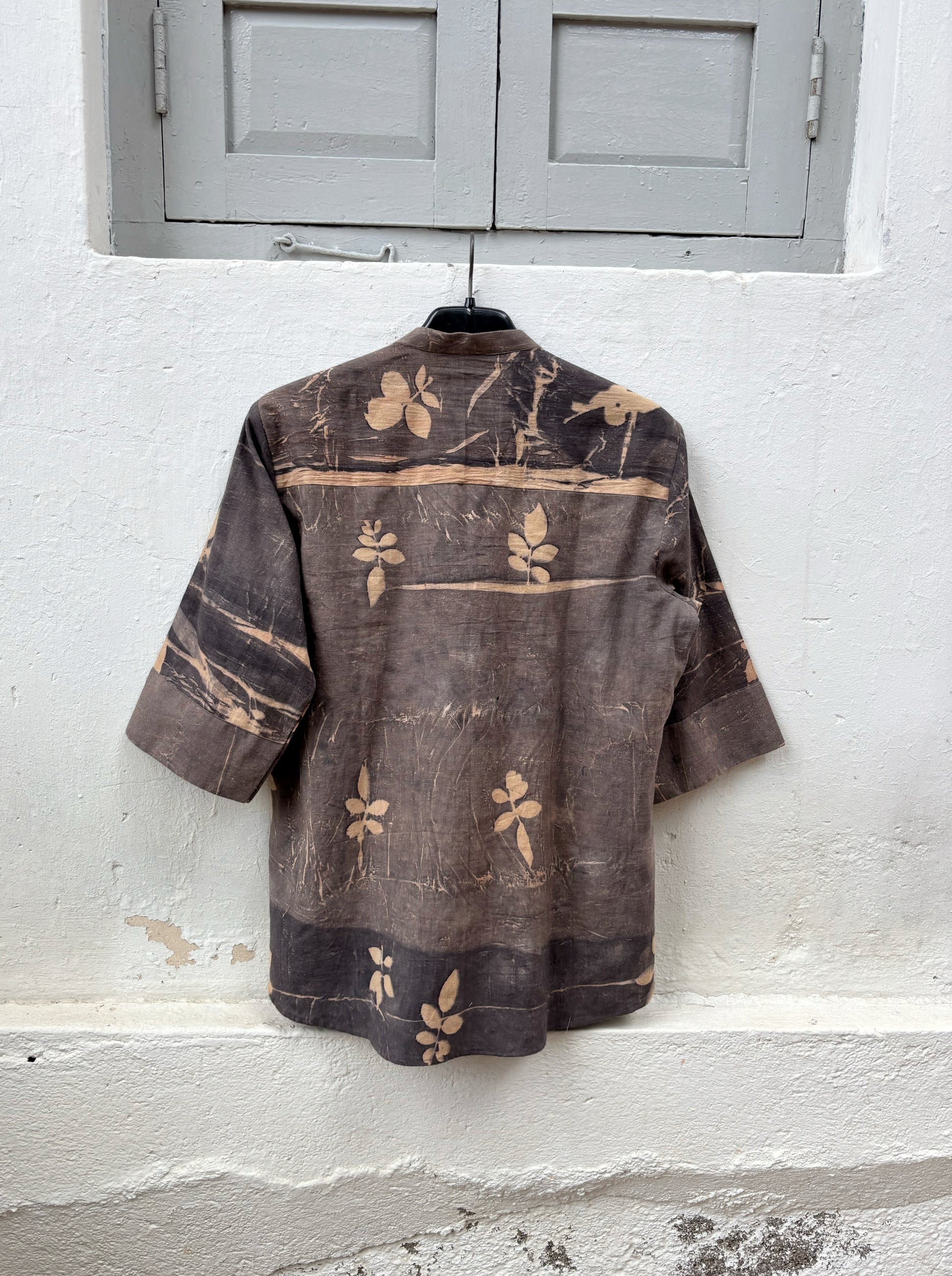 Hand-spun and hand-woven cotton shirt naturally dyed in earthy brown-grey with botanical eco prints