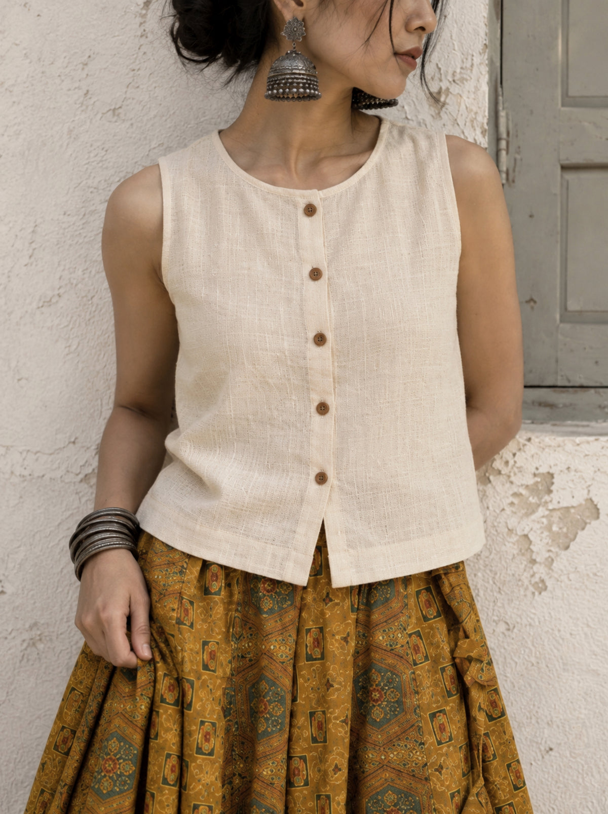 Eka undyed off-white handspun handwoven cotton sleeveless top with round neck and wooden buttons
