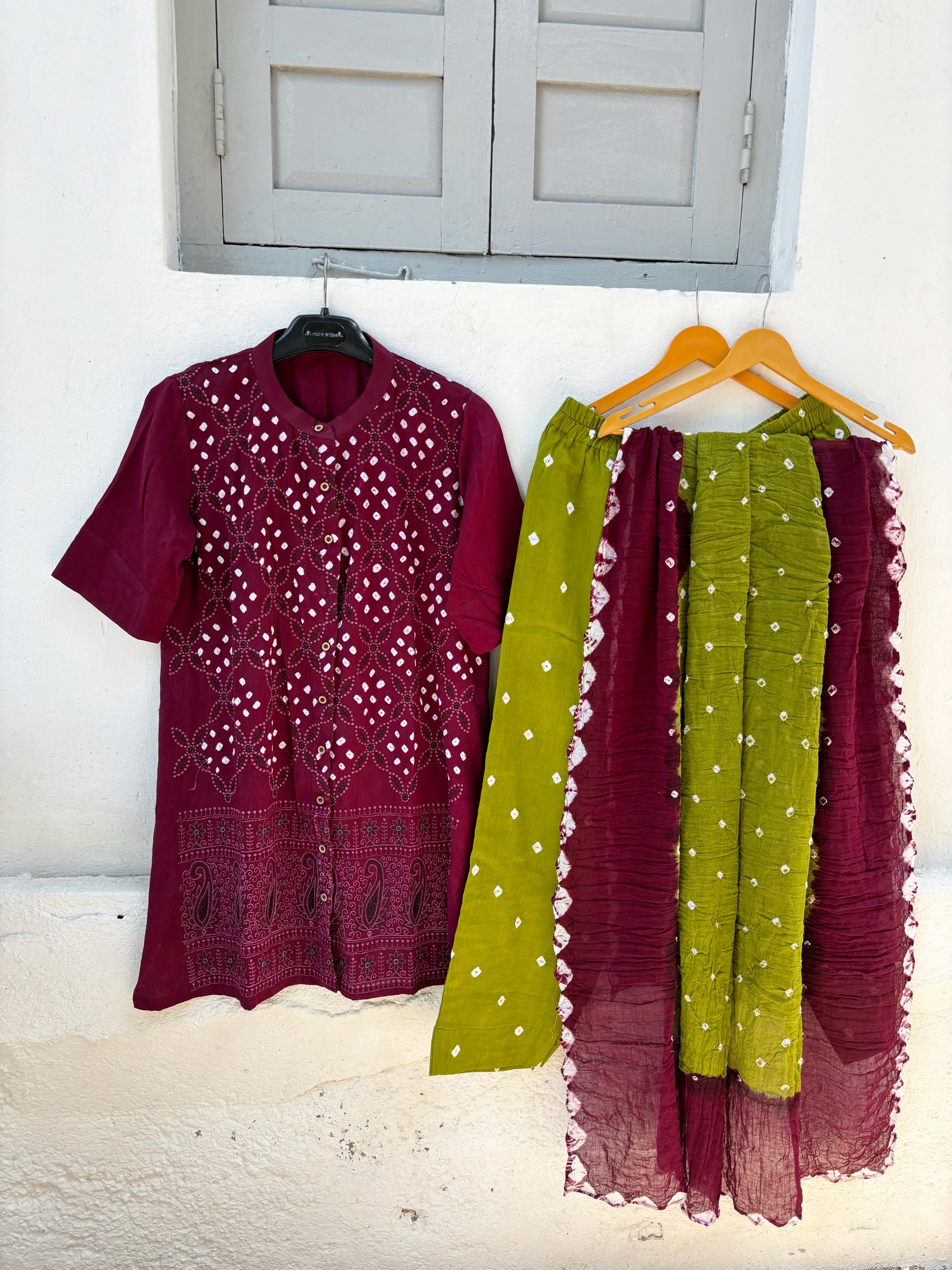 Deep wine and green Bandhani three-piece set with embroidered kurta, Bandhani pants and hand tie-dyed dupatta for women