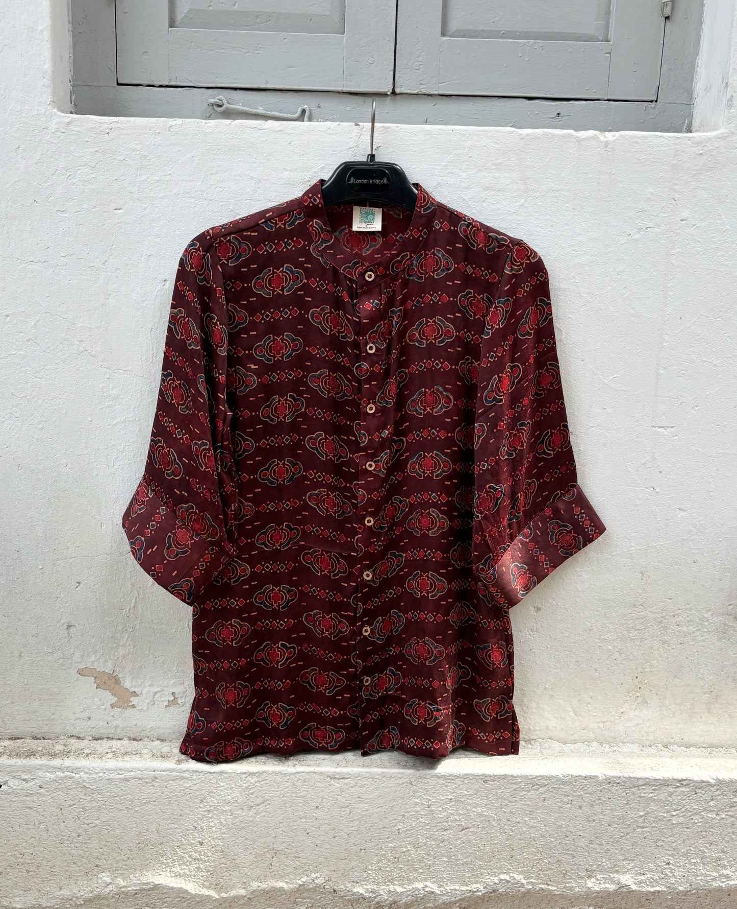 Natural dyed Ajrakh hand block printed modal silk shirt for women in deep wine maroon with traditional floral and geometric motifs.