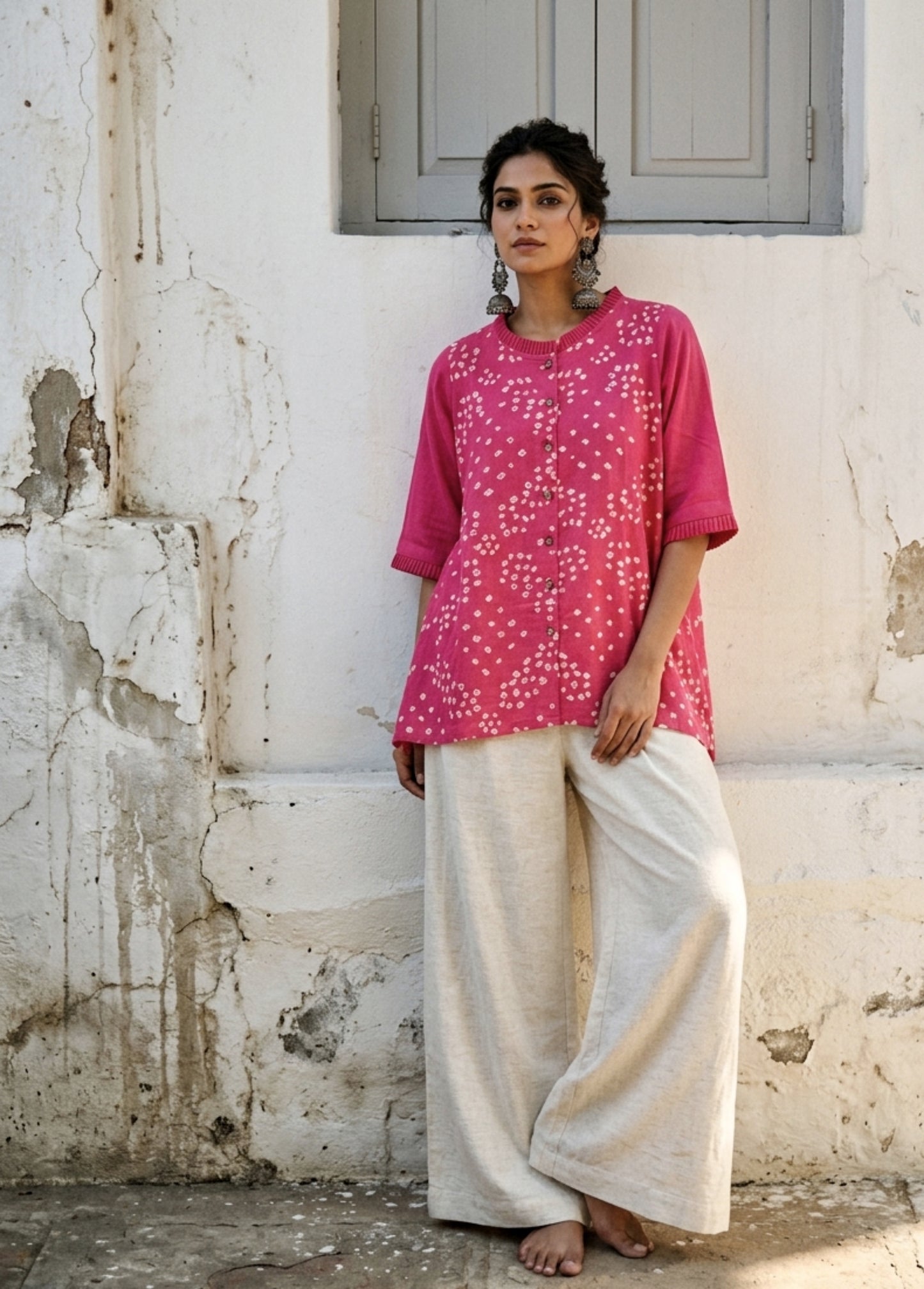 Pink Bandhani shirt for women with scattered hand tie dyed ivory dots, pleated neckline and sleeves, cotton satin relaxed fit