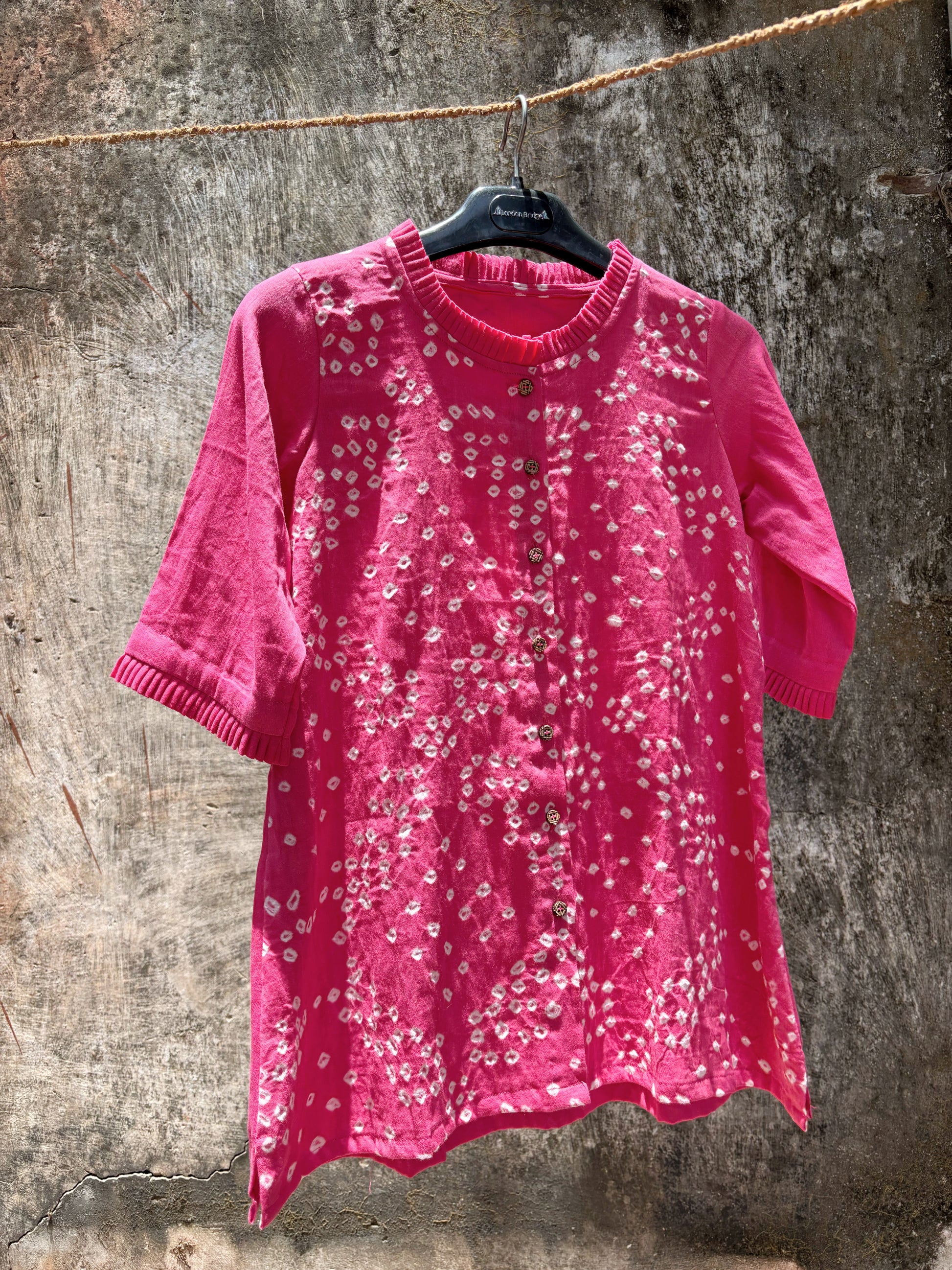 Pink Bandhani shirt for women with scattered hand tie dyed ivory dots, pleated neckline and sleeves, cotton satin relaxed fit