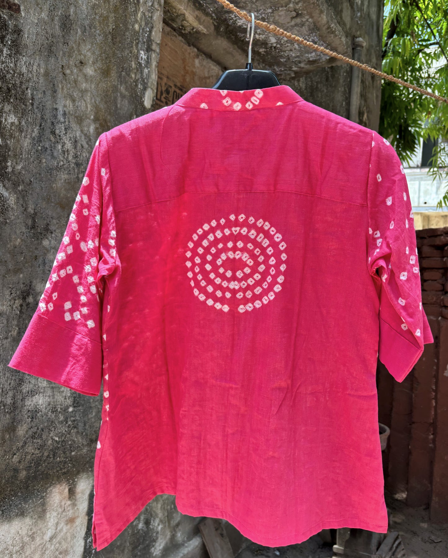 Pink Bandhani shirt for women with scattered hand tie dyed ivory dots, pleated neckline and sleeves, cotton satin relaxed fit