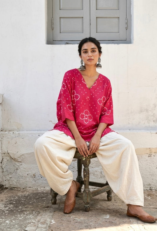  Pink Bandhani V-neck top for women with floral motifs in front and round design at back, hand tie dyed on cotton satin