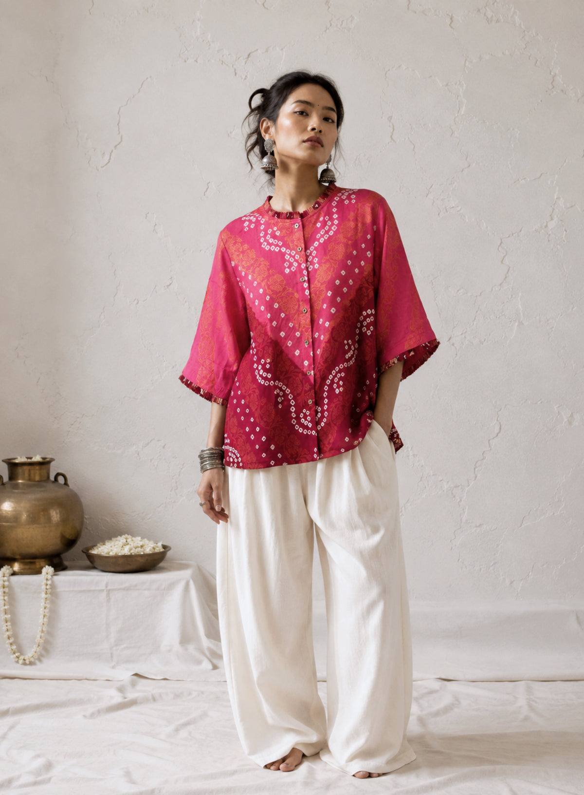 Gulabi is a dusty rose and maroon wine Bandhani cotton shirt with ivory hand-tied Bandhani, antique-gold Banarasi weaves and pleated detailing.