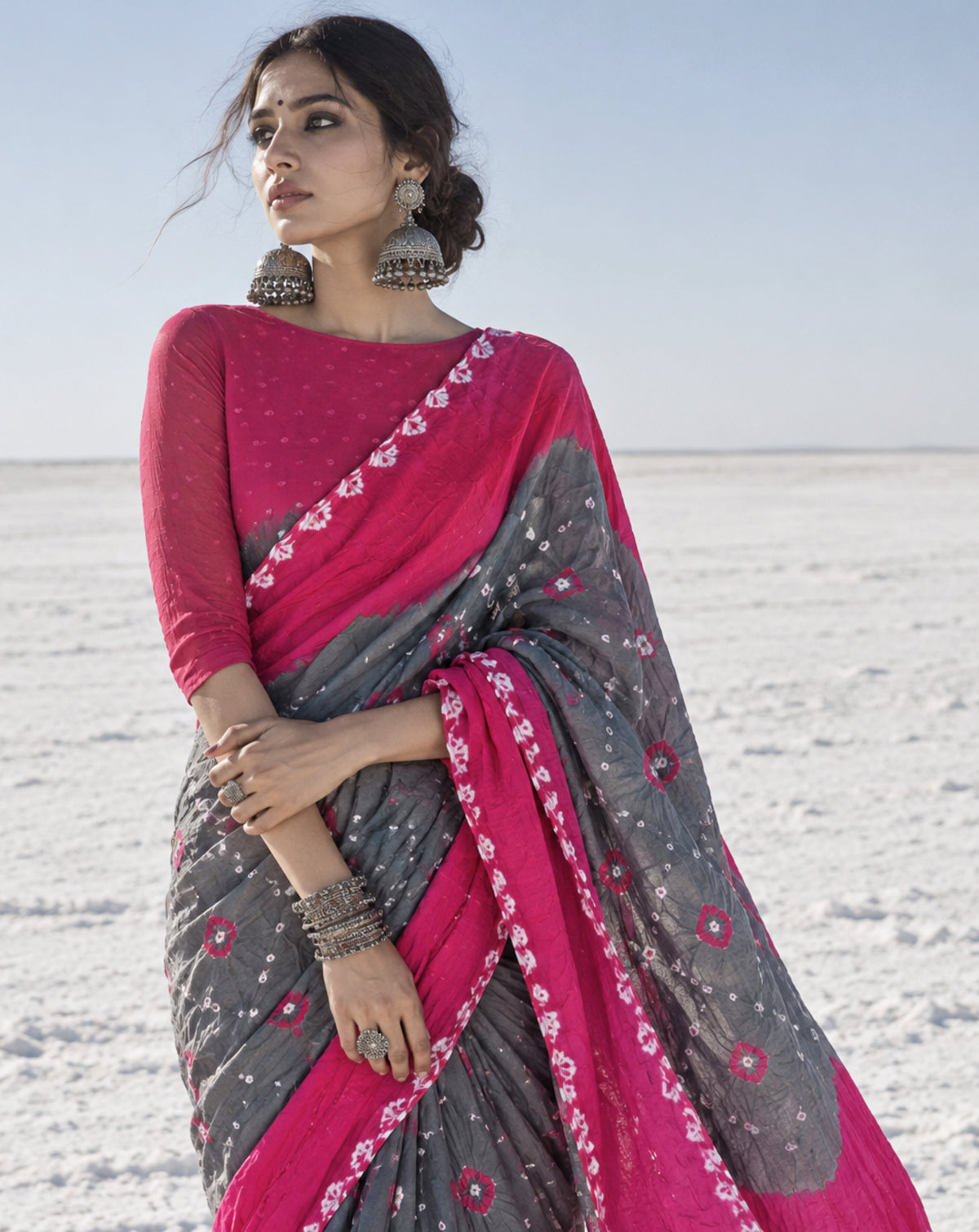 Gulabi pink and grey hand tie-dyed Bandhani cotton saree with pink floral motifs and white dotted patterns
