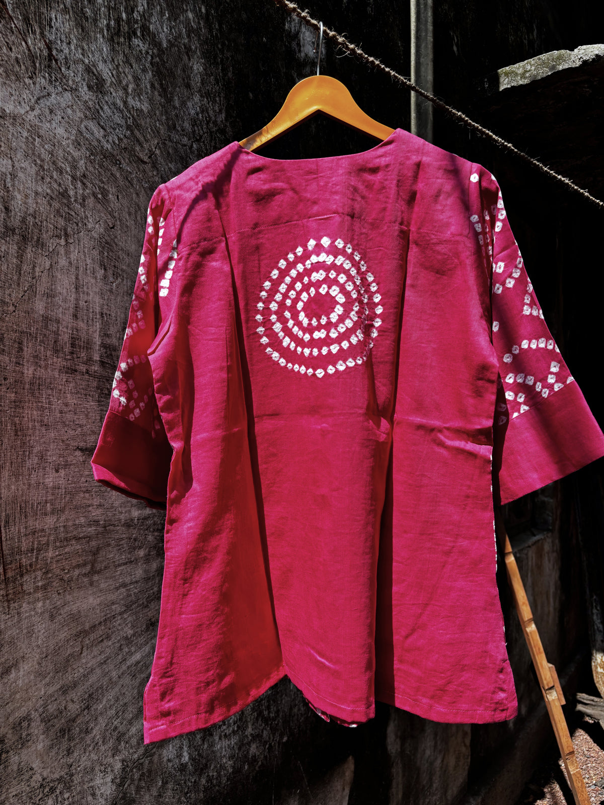 Subtle gulabi pink cotton shirt with hand tie-dyed ivory Bandhani circular motifs, round neckline and 3/4 sleeves.