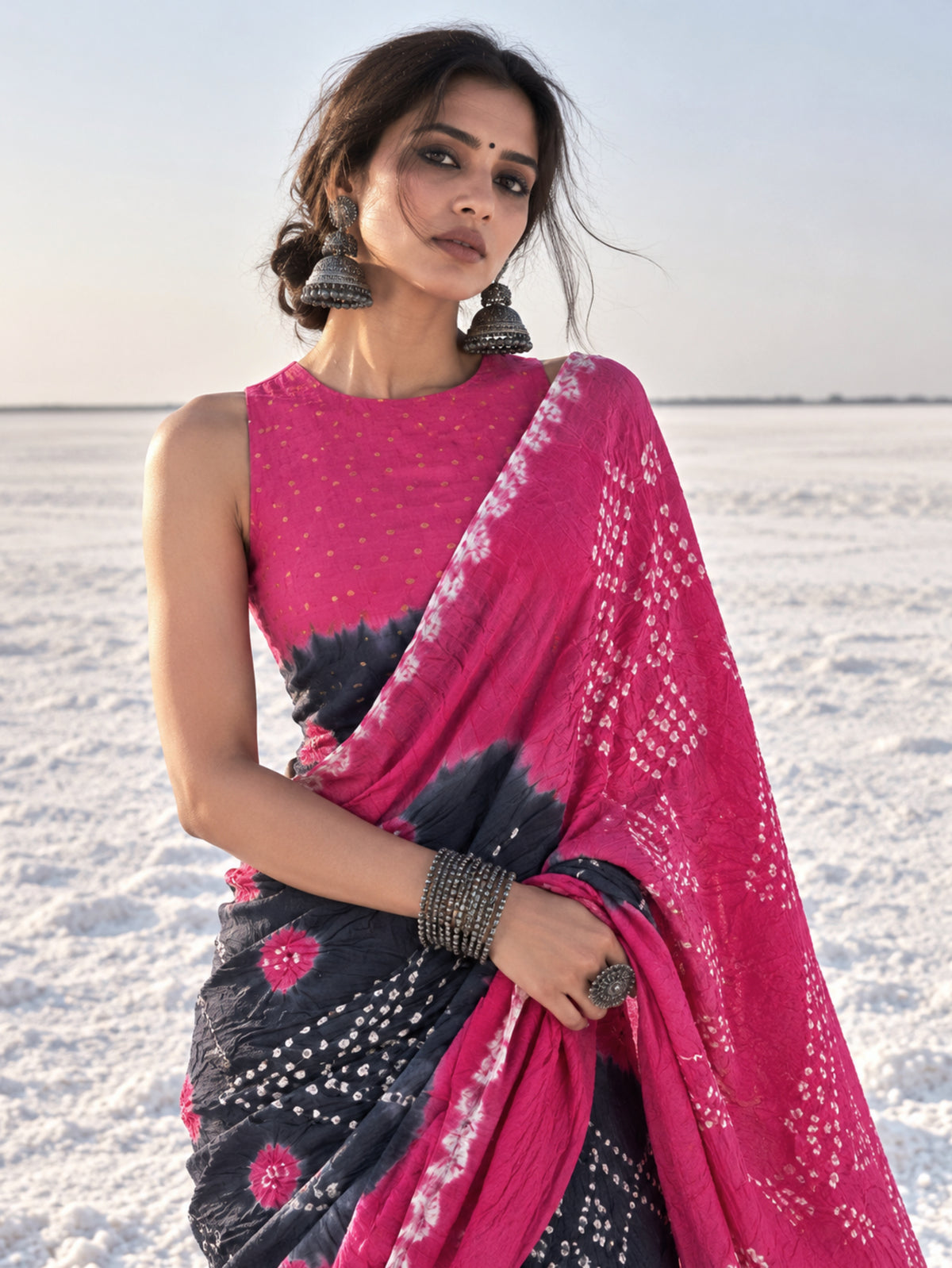 Gulabi pink and smoky navy blue hand tie-dyed Bandhani cotton saree with floral and geometric motifs
