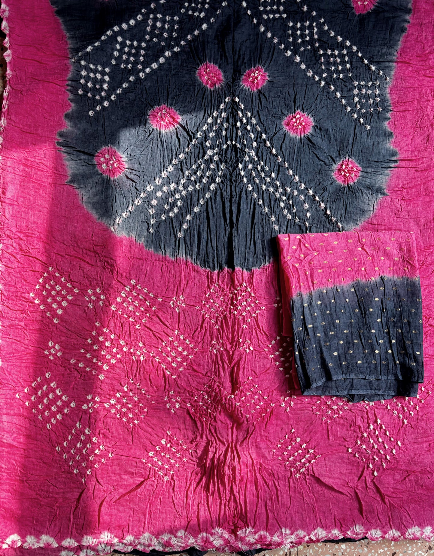 Gulabi pink and smoky navy blue hand tie-dyed Bandhani cotton saree with floral and geometric motifs

