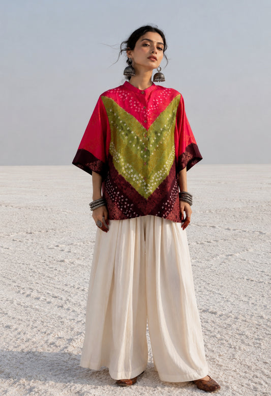 Handcrafted Bandhani festive cotton shirt in Rani Pink, Olive Green and Deep Wine Maroon with antique gold woven floral motifs, round band neckline, short button placket, relaxed fit and three-quarter sleeves.