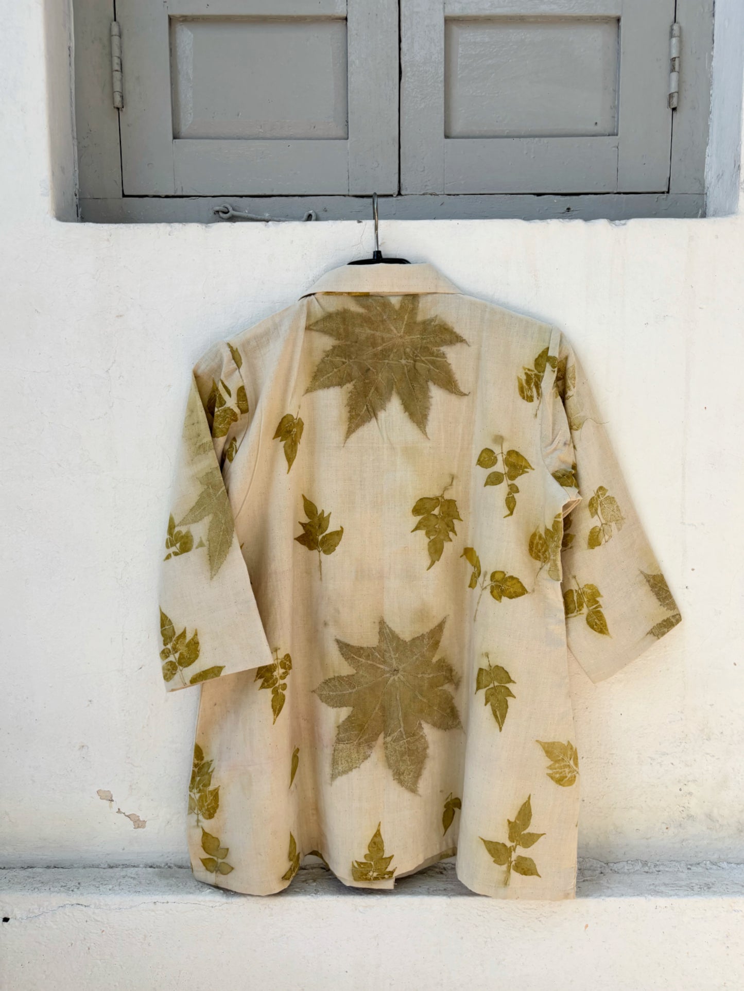 Handspun handwoven cotton eco print shirt for women in sand beige with natural leaf prints in olive tones, relaxed fit, handmade and naturally dyed.
