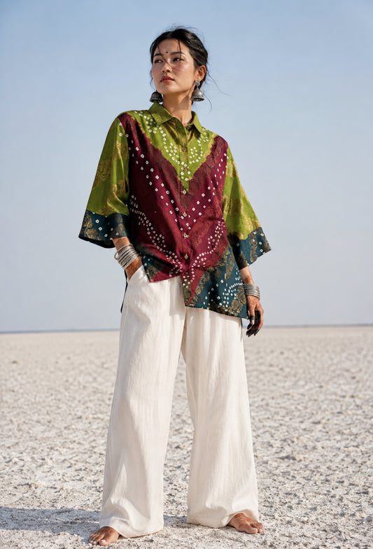 Handcrafted Bandhani festive cotton shirt in Leaf Green, Wine Maroon and Deep Teal with antique gold woven floral motifs, classic shirt collar, front button closure, relaxed fit and three-quarter sleeves.

