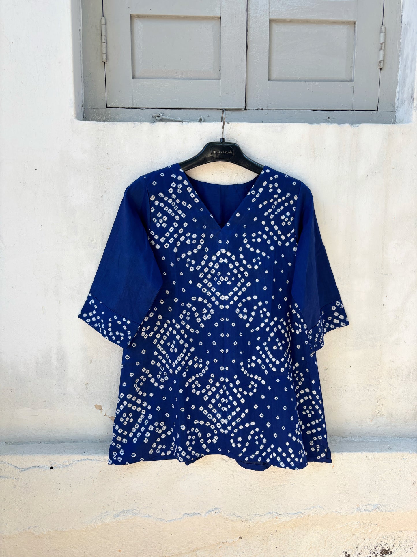 Indigo Bandhani top for women with hand tie dyed white geometric patterns on cotton satin, relaxed fit and V-neck design