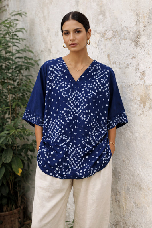 Indigo Bandhani top for women with hand tie dyed white geometric patterns on cotton satin, relaxed fit and V-neck design