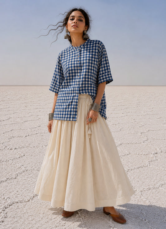 Indigo Meadow hand spun handwoven cotton checks shirt in deep indigo blue and natural ivory gingham with a band collar, wooden buttons and relaxed silhouette.