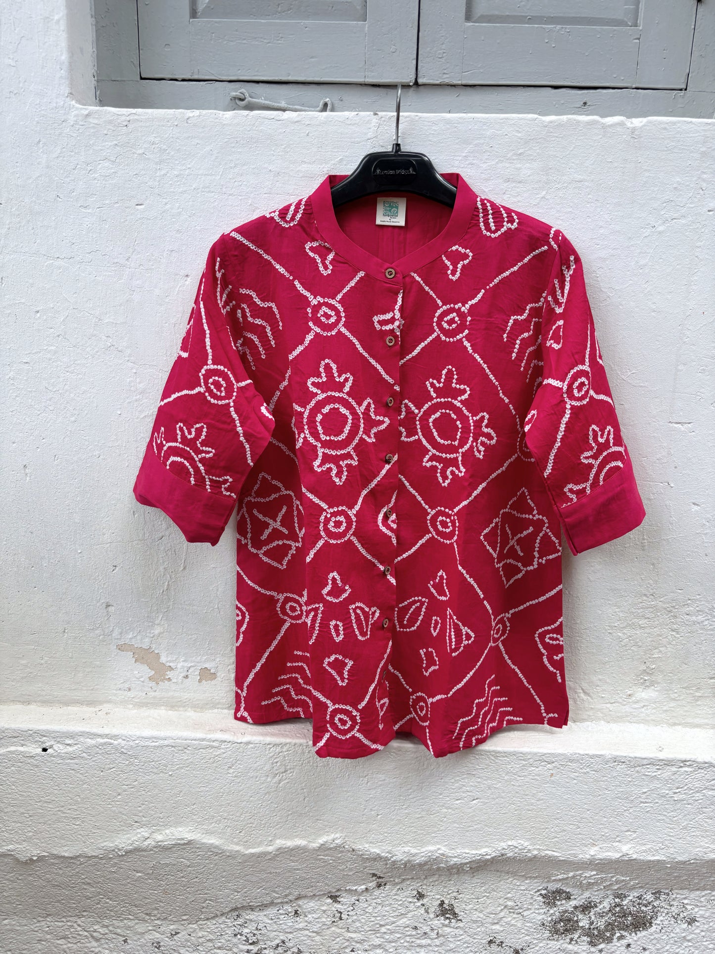 Jalsa festive Rai Bandhani cotton satin shirt in raspberry pink with ivory hand tie-dyed Bandhani and soft mandarin collar
