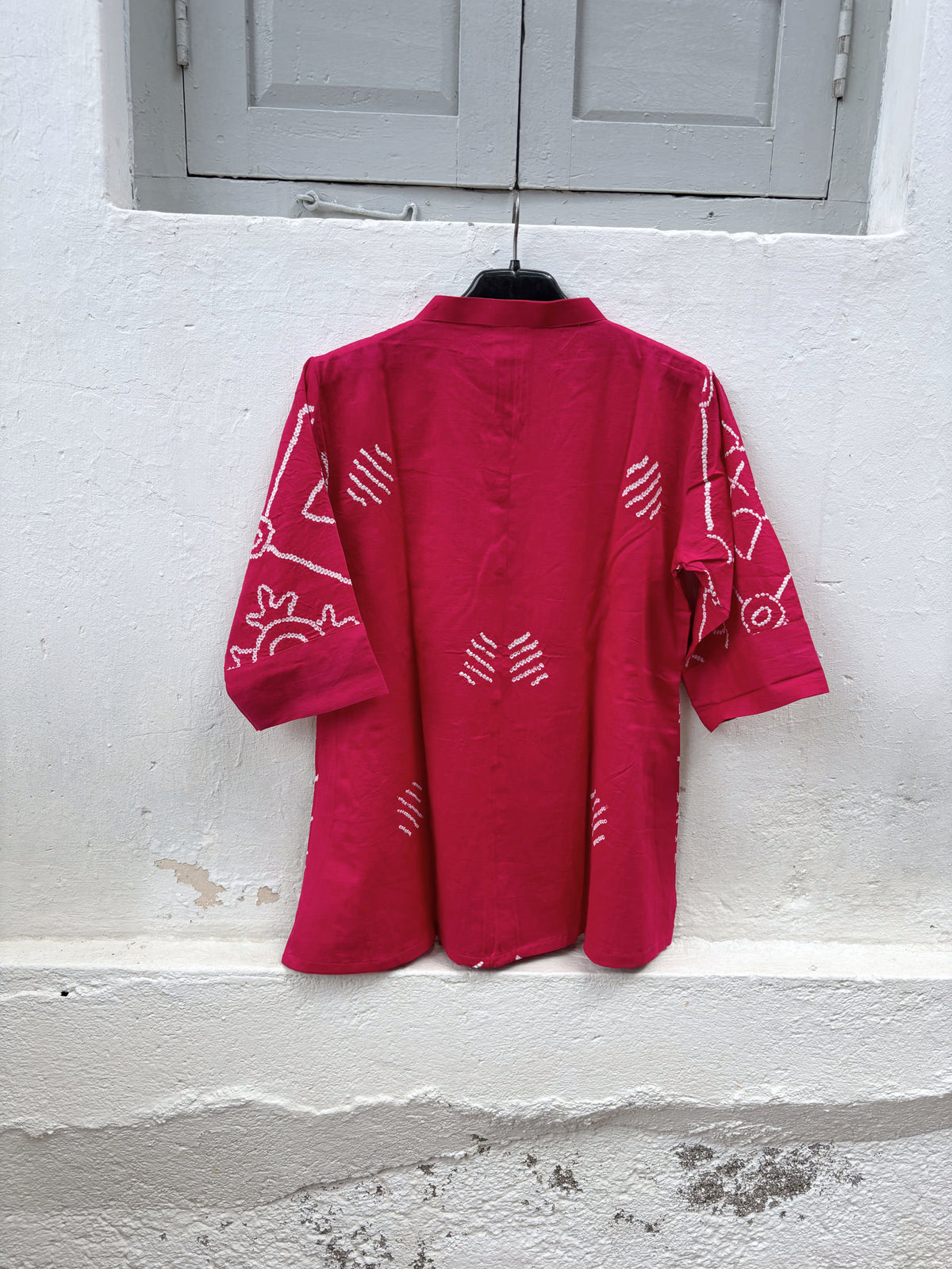 Jalsa festive Rai Bandhani cotton satin shirt in raspberry pink with ivory hand tie-dyed Bandhani and soft mandarin collar
