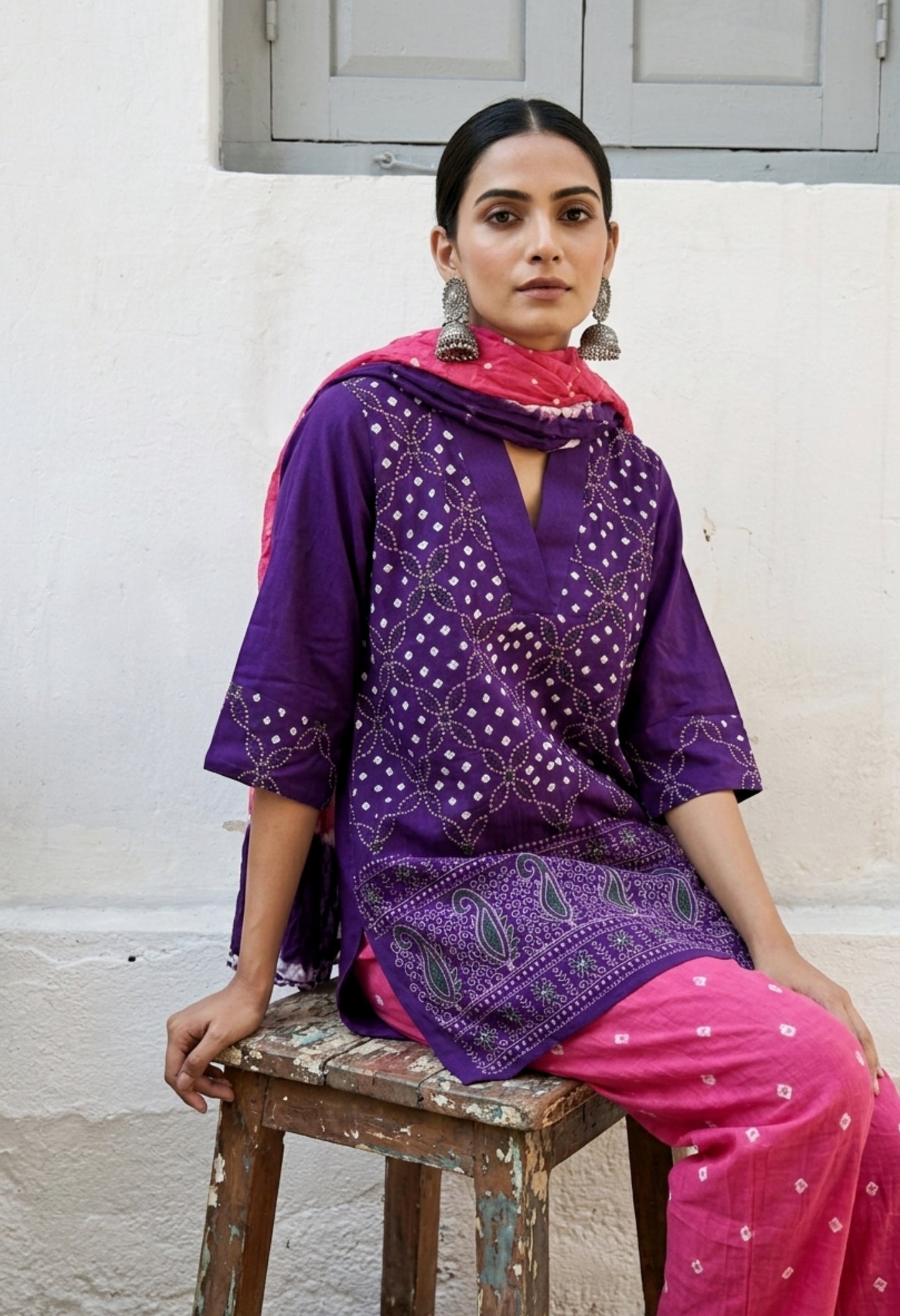 Purple and pink Bandhani three-piece set for women with embroidered top, comfortable-fit pants and hand tie dyed dupatta