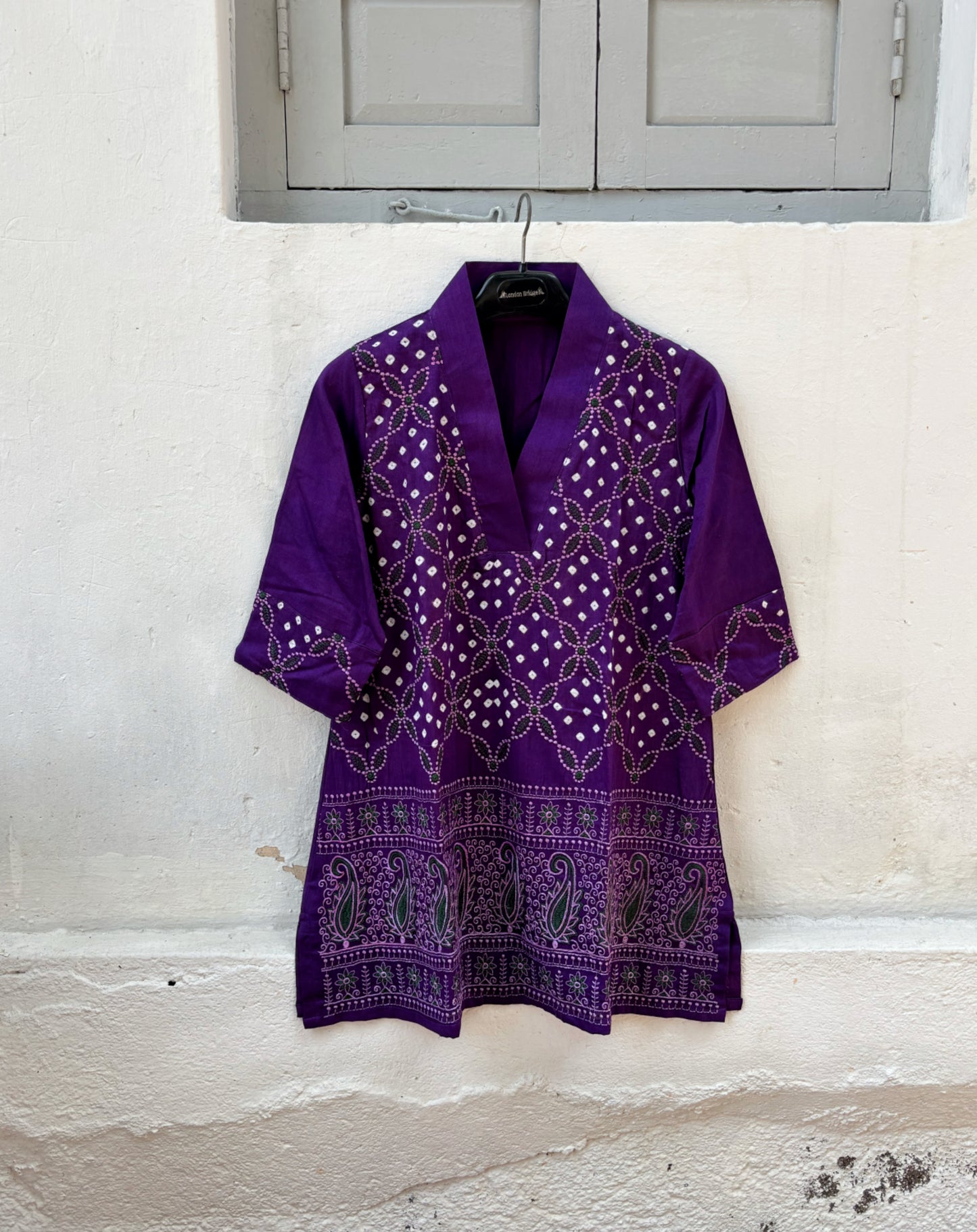 Purple and pink Bandhani three-piece set for women with embroidered top, comfortable-fit pants and hand tie dyed dupatta