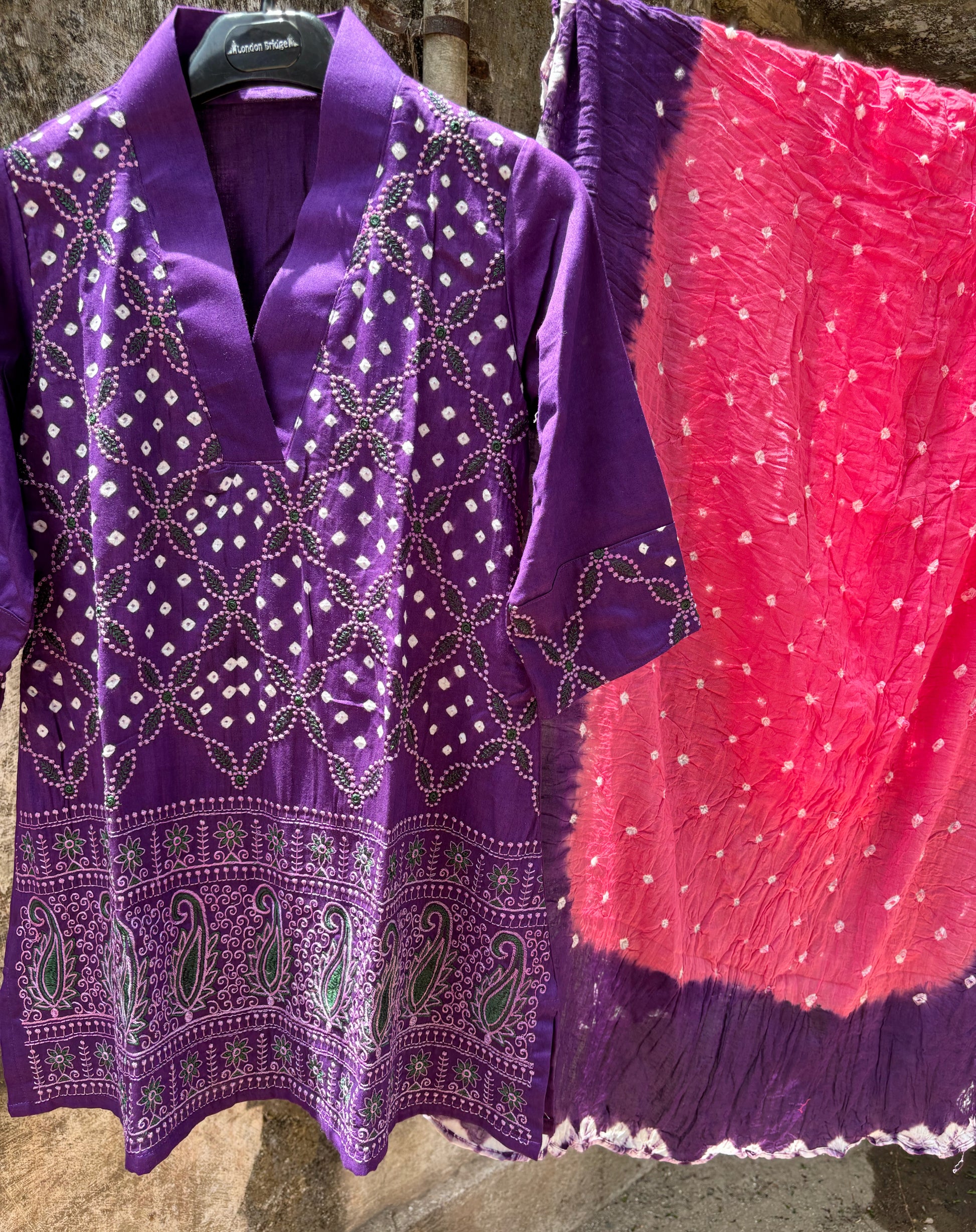 Purple and pink Bandhani three-piece set for women with embroidered top, comfortable-fit pants and hand tie dyed dupatta