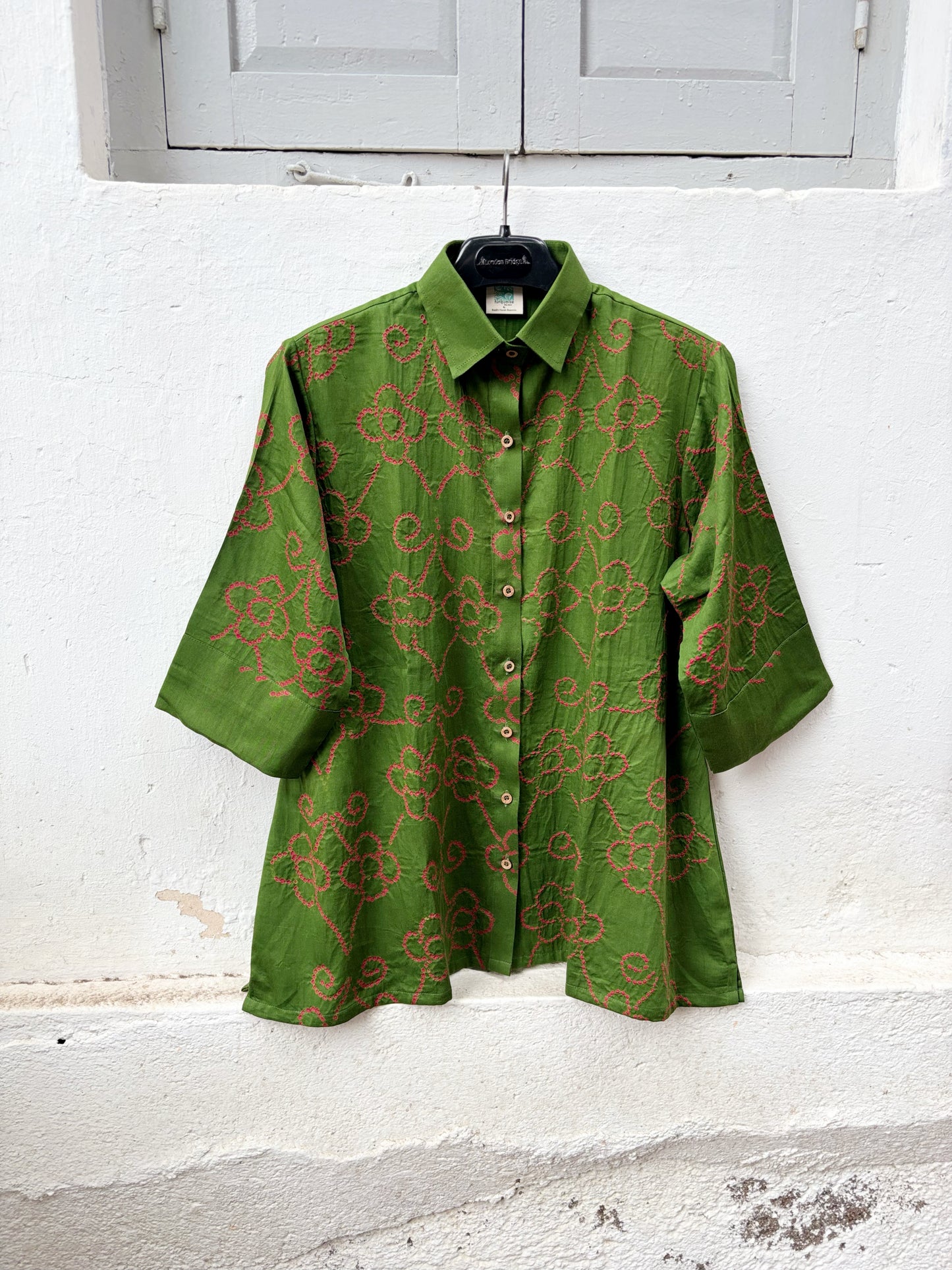 Leaf green cotton Jhankaar Bandhani shirt with deep berry pink floral vine motifs, shirt collar and relaxed relaxed fit.