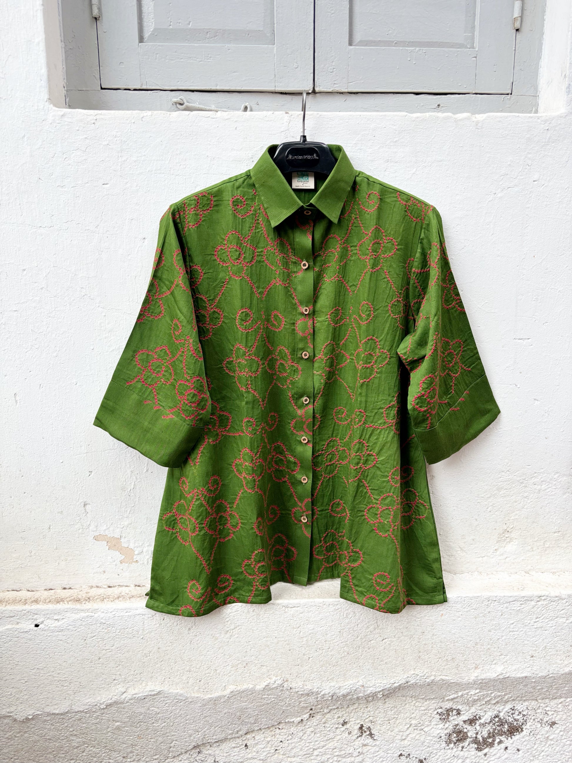 Leaf green cotton Jhankaar Bandhani shirt with deep berry pink floral vine motifs, shirt collar and relaxed relaxed fit.