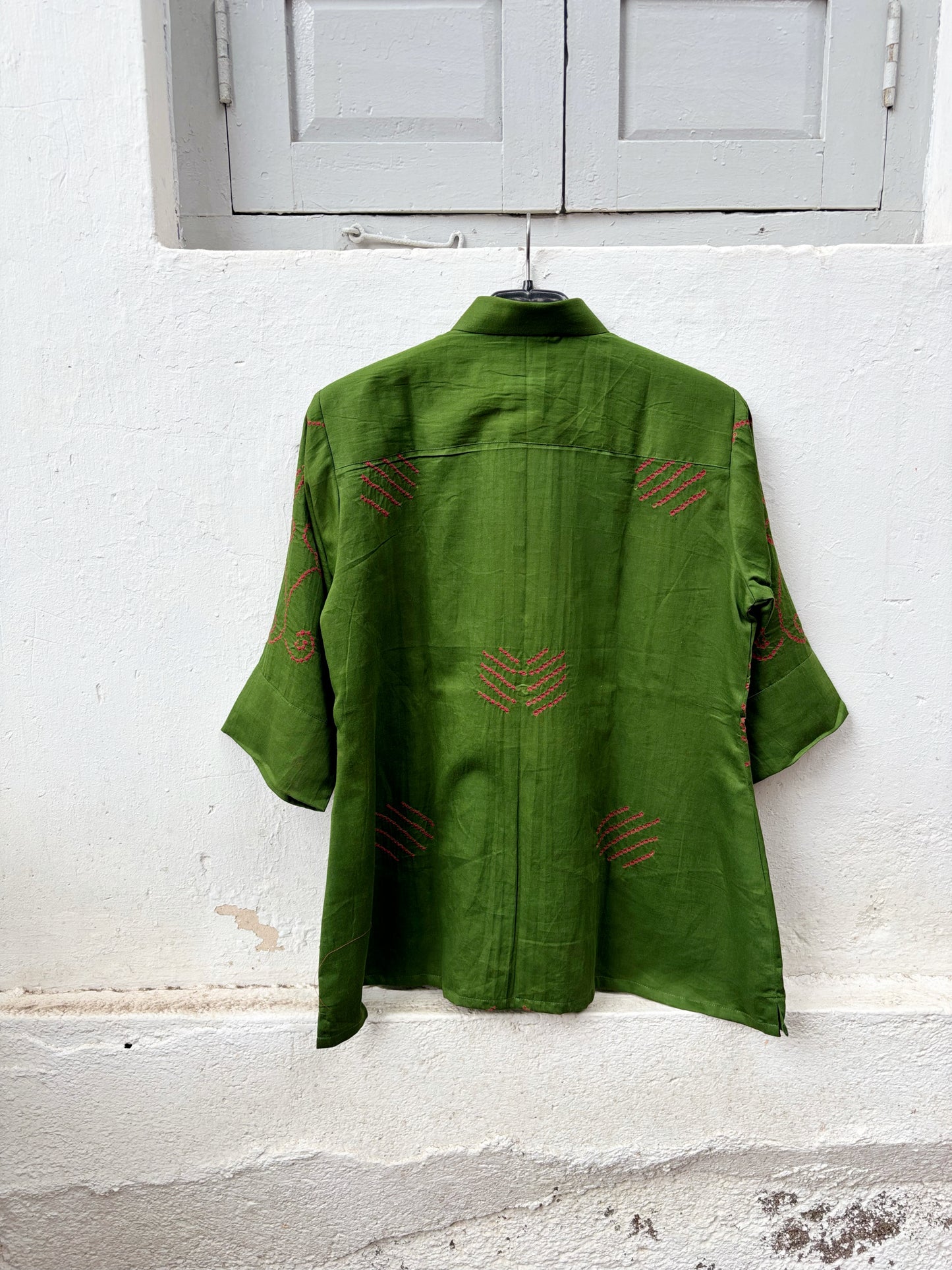 Leaf green cotton Jhankaar Bandhani shirt with deep berry pink floral vine motifs, shirt collar and relaxed relaxed fit.