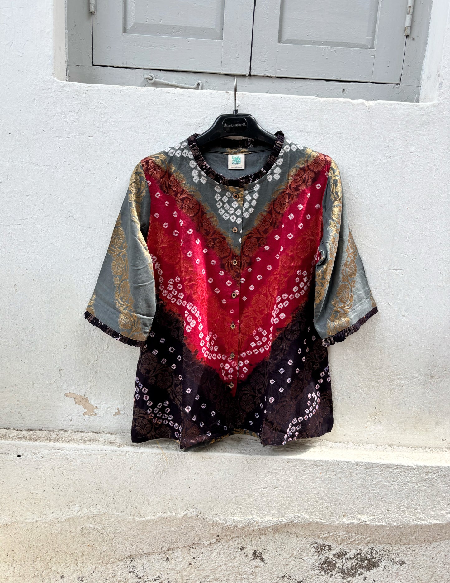 Handcrafted Bandhani festive cotton shirt in Smoky Grey, Crimson Red and Classic Black with antique gold woven floral motifs, a pleated round neckline, front button placket and relaxed fit.